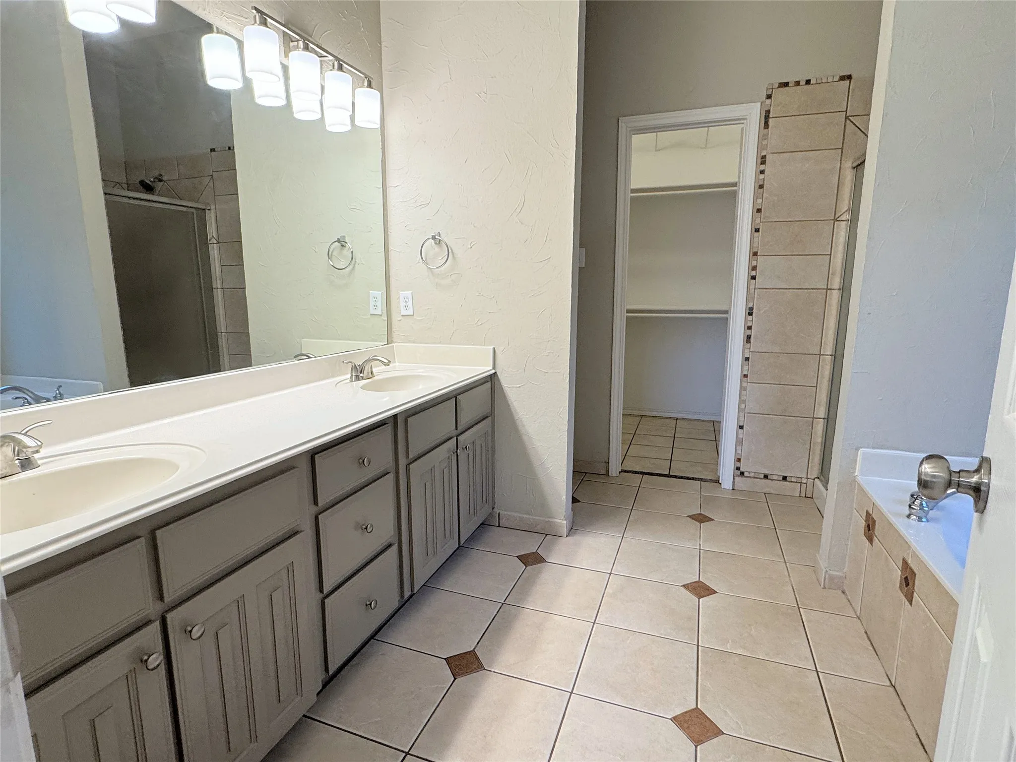 Primary bath features dual vanities
