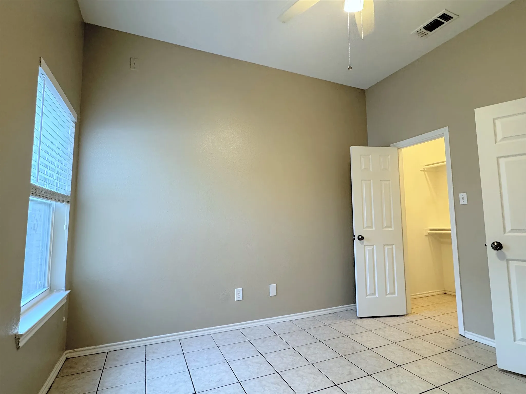This bedroom has a large walk-in closet