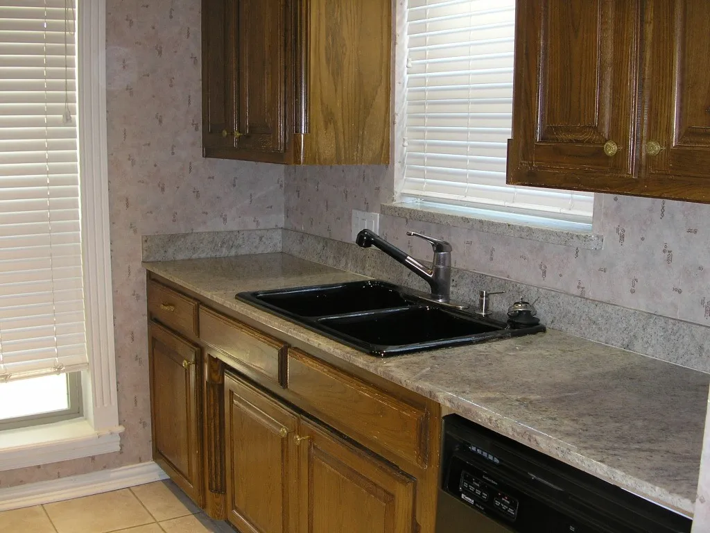Galley style, granite countertops, dishwasher.