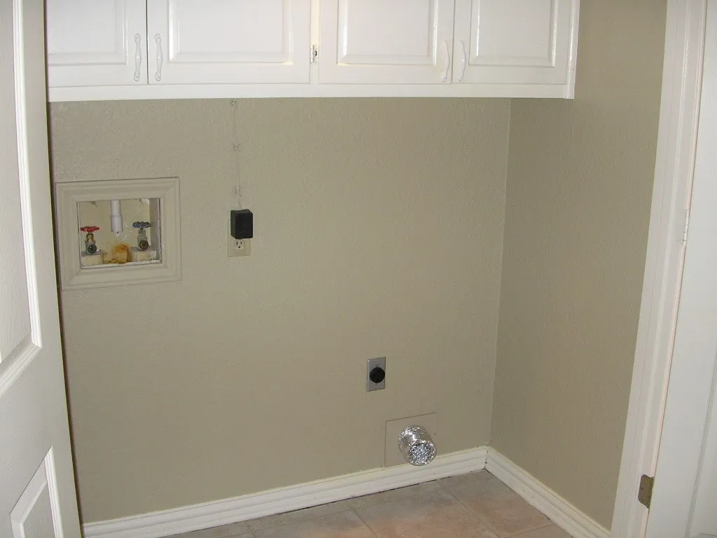Electric dryer hook-up, upper storage cabinets
