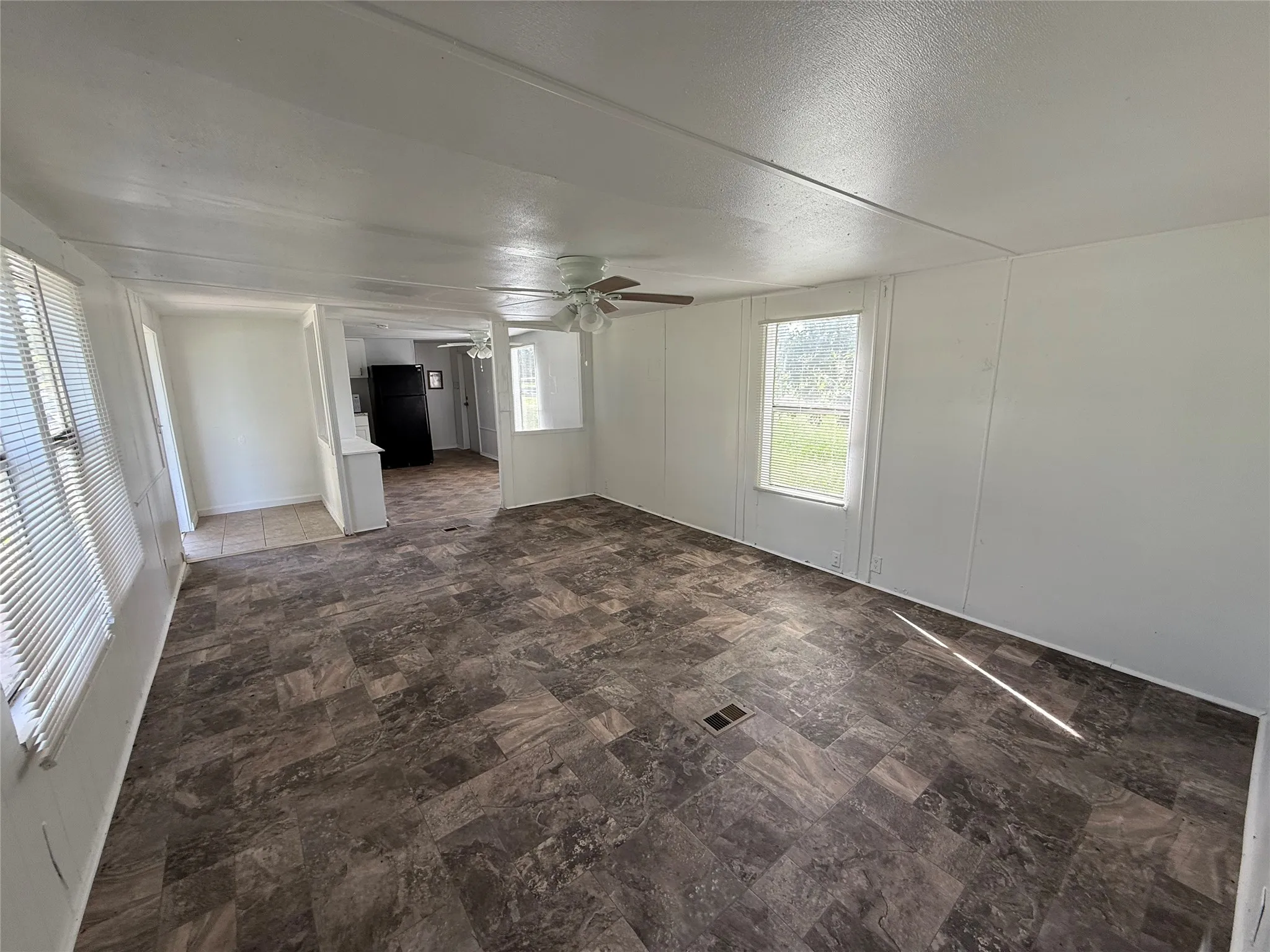 Large living room with view towards kitchen