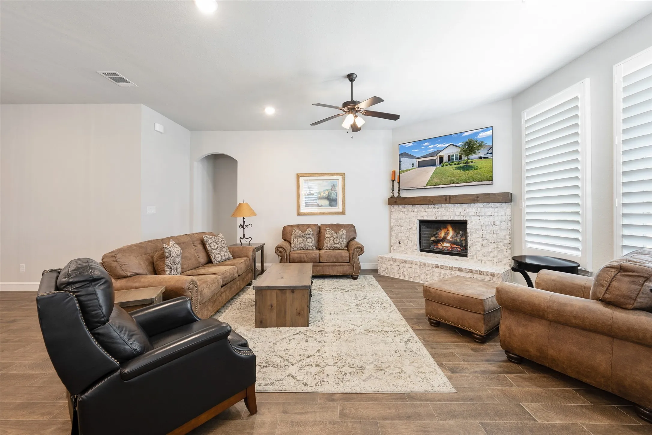 Spacious living room with wood burning fireplace