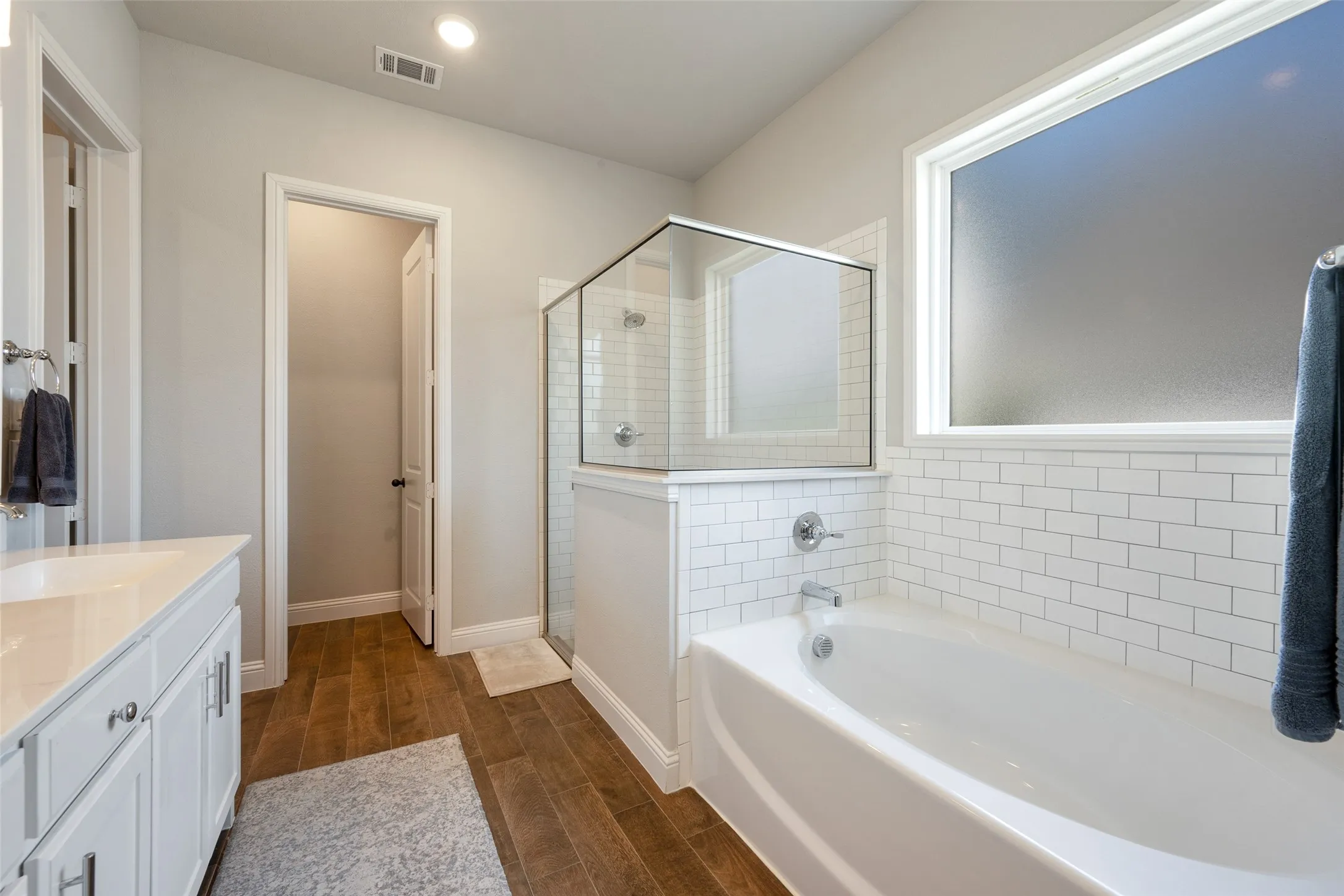 Master bathroom with separate shower and garden tub