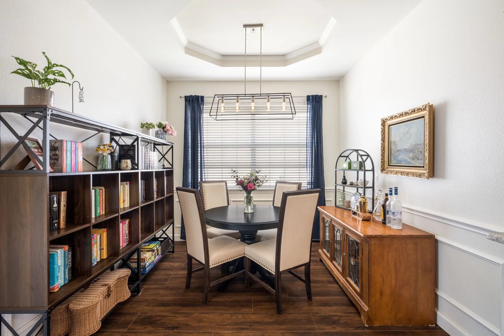 Tray ceiling with a suspended linear chandelier