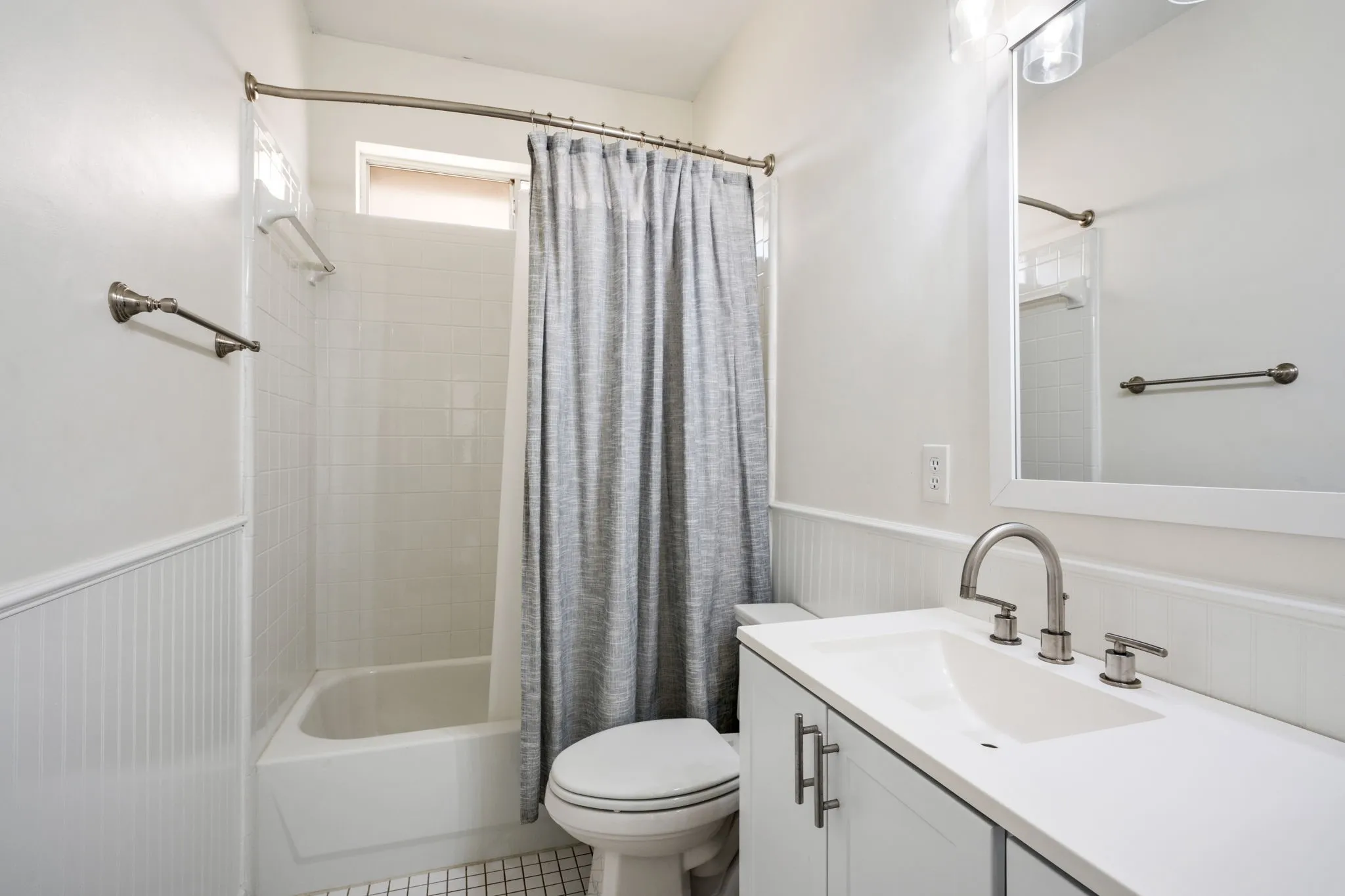 White subway tile shower surround with integrated tub