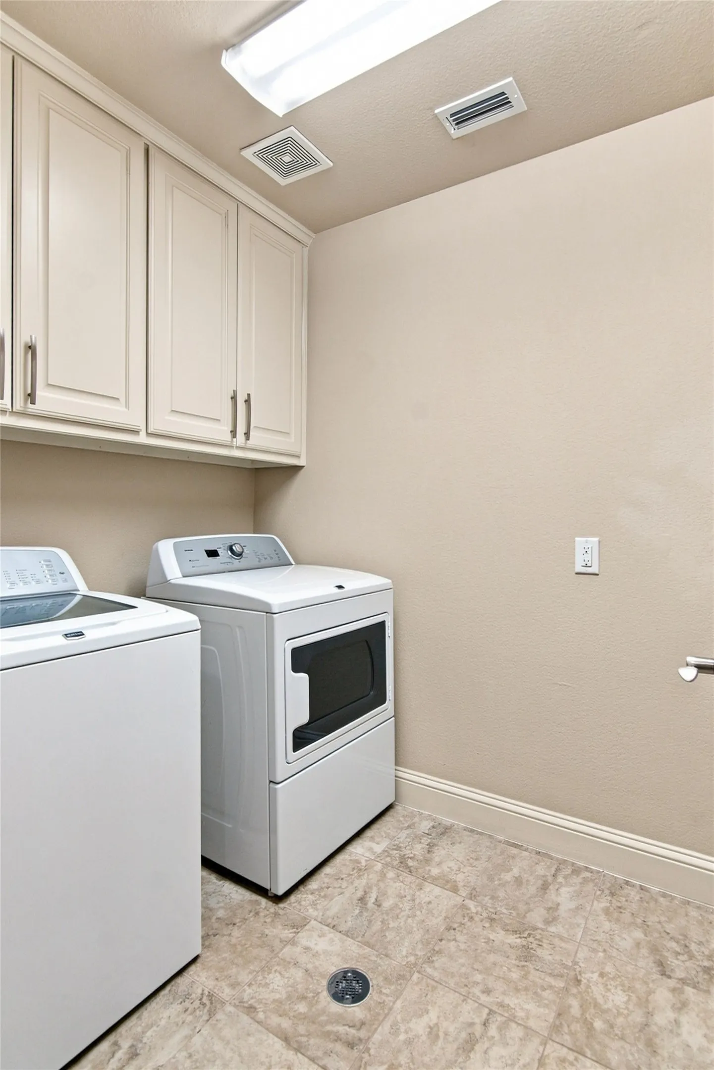 Upper cabinetry with brushed nickel hardware