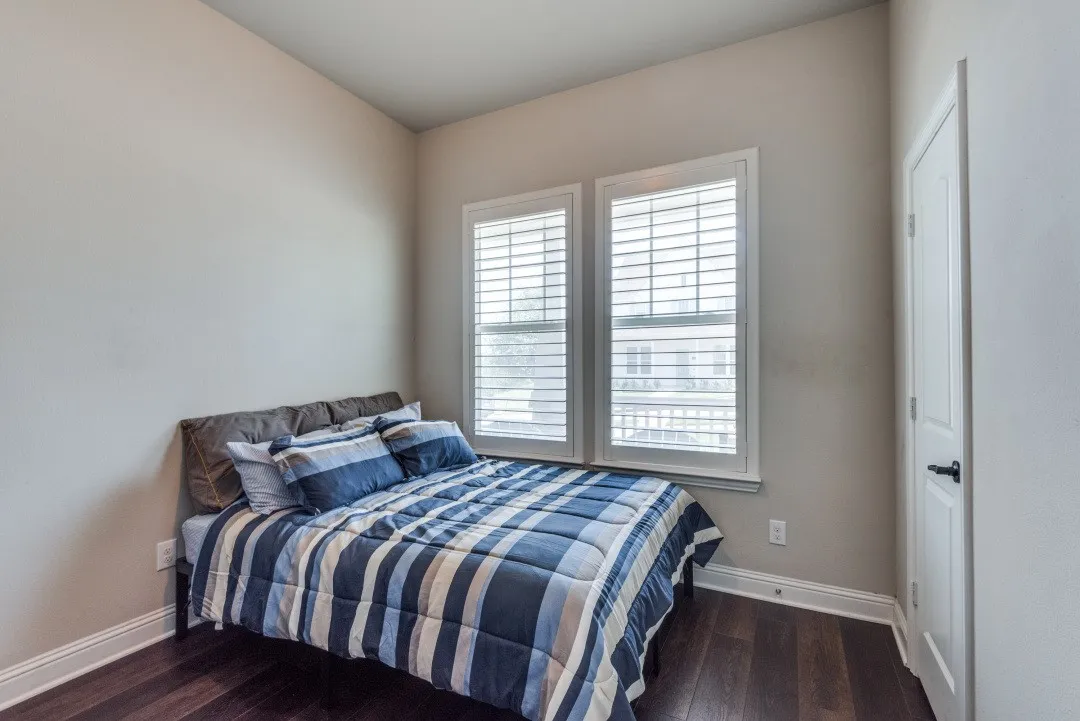 Warm-toned walls with dark wood-finish flooring