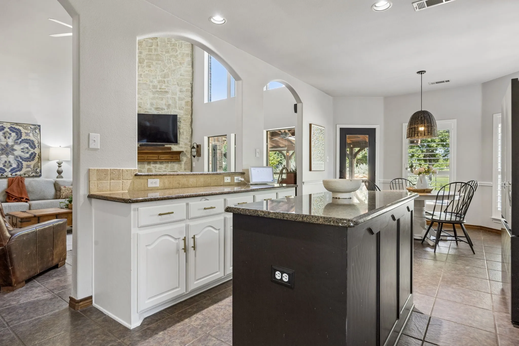 Made for Cooking and Conversation - A large center island anchors the kitchen while open sightlines into the family room and breakfast area keep the cook connected to everything happening around them.