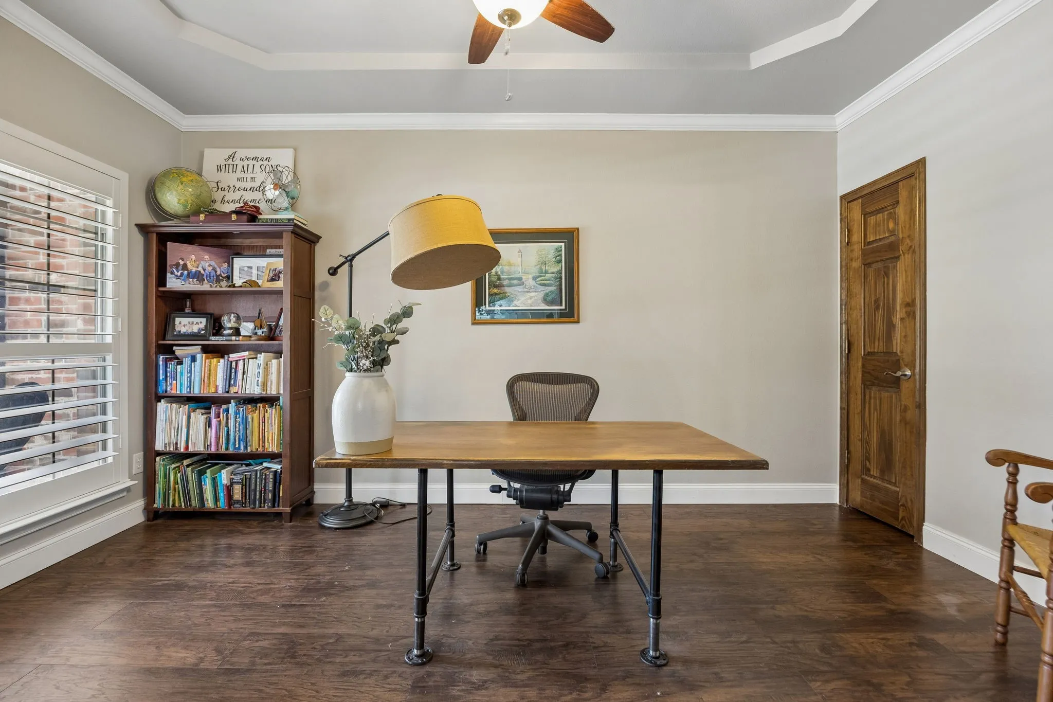 A Dedicated Work-From-Home Space - The private home office features hand-scraped hardwood floors, a tray ceiling and substantial dimensions, creating a comfortable setting for focused work, meetings or managing the household.