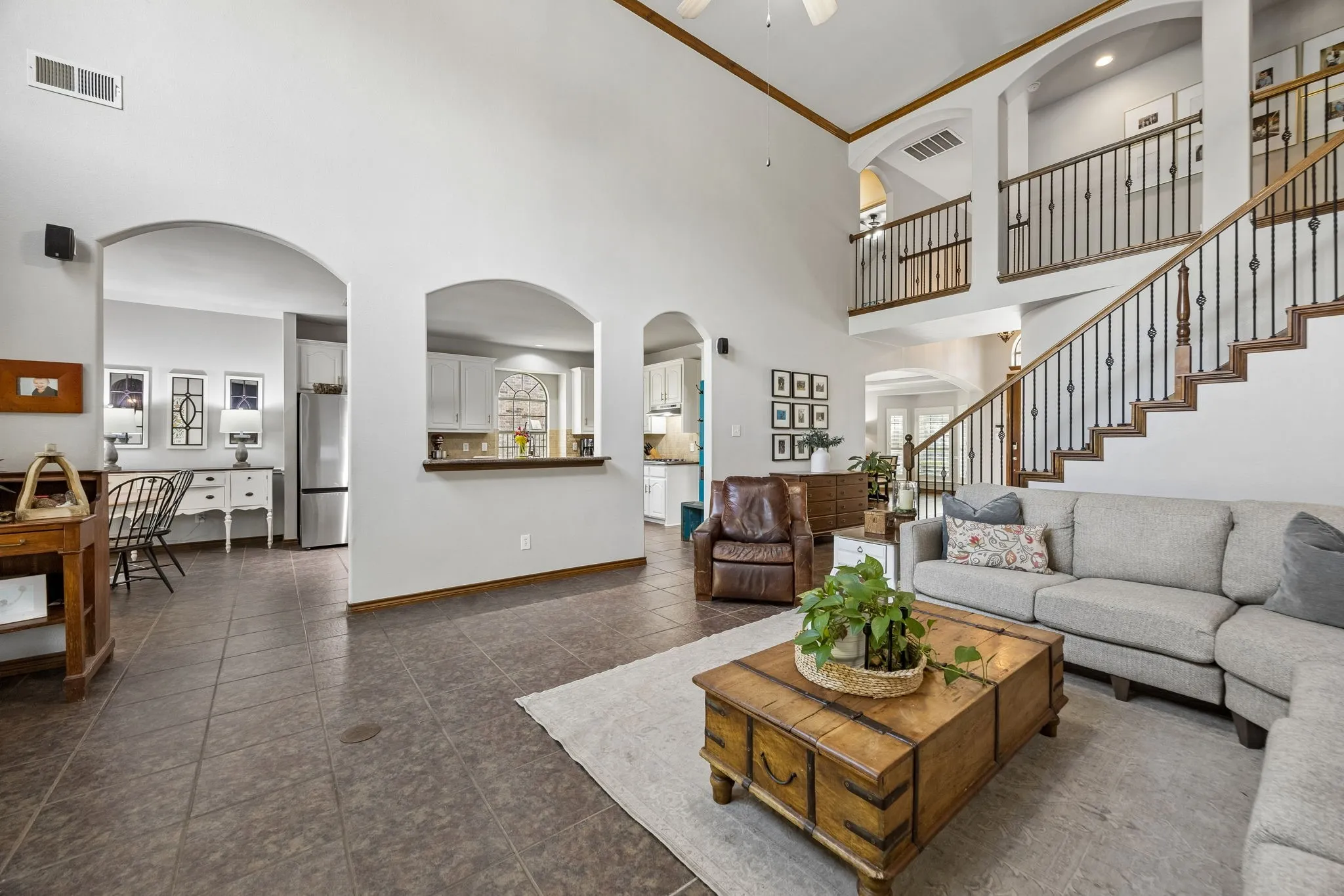 Designed for Everyday Flow - Wide arched openings connect the family room with the kitchen and surrounding living spaces, allowing conversation and activity to move naturally throughout the main level.