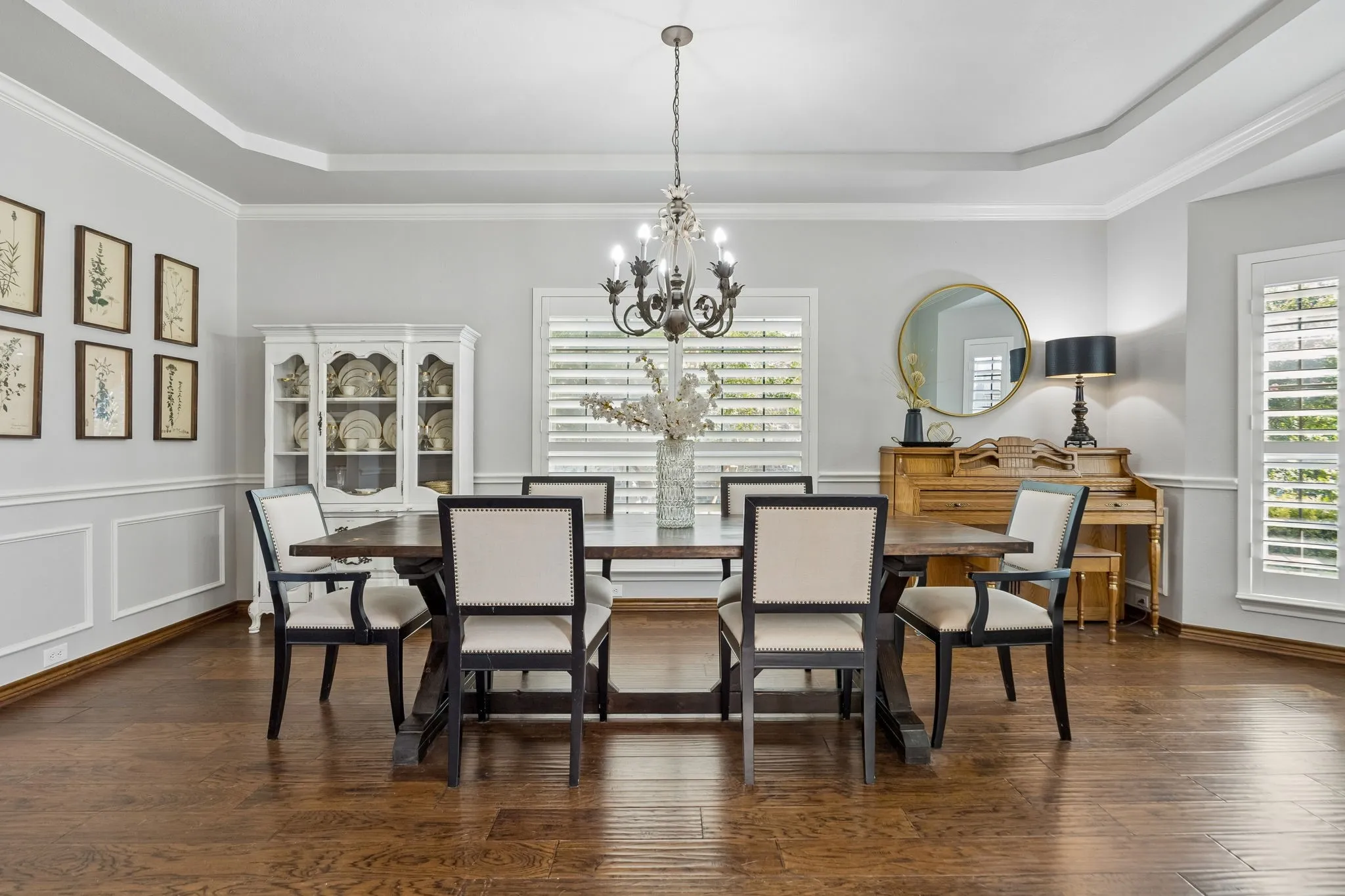 Room to Gather - The formal dining room offers hand-scraped hardwood floors, a tray ceiling, crown molding and generous proportions for everything from weeknight dinners to larger holiday gatherings.