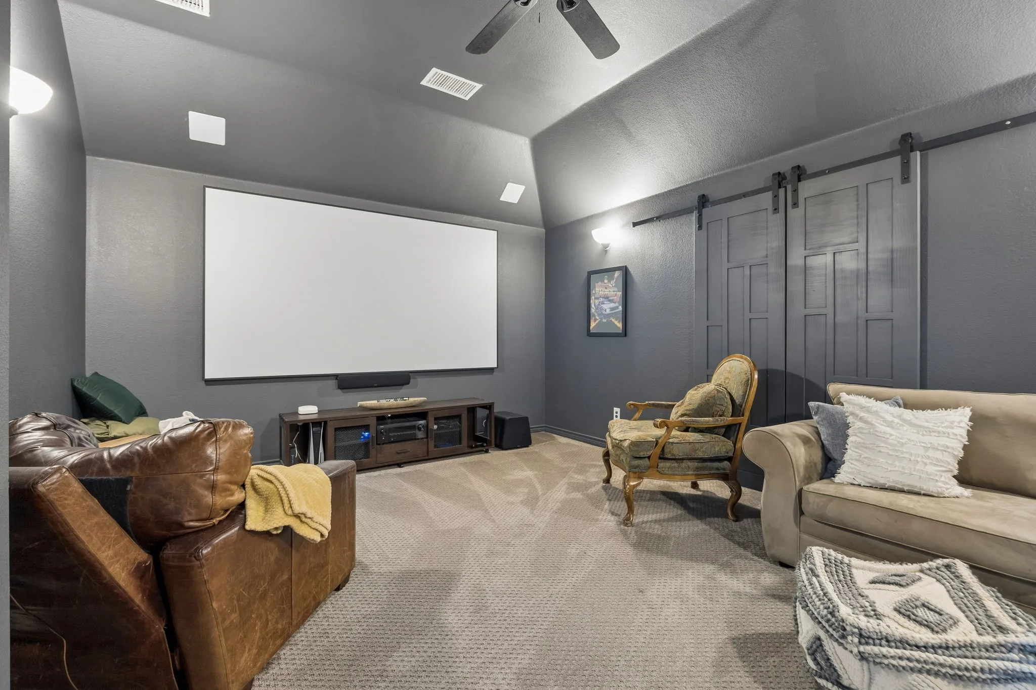 Movie Night Has Its Own Room - The dedicated media room provides an enclosed setting for movies, sports and gaming, creating a comfortable destination away from the home’s more open gathering spaces.