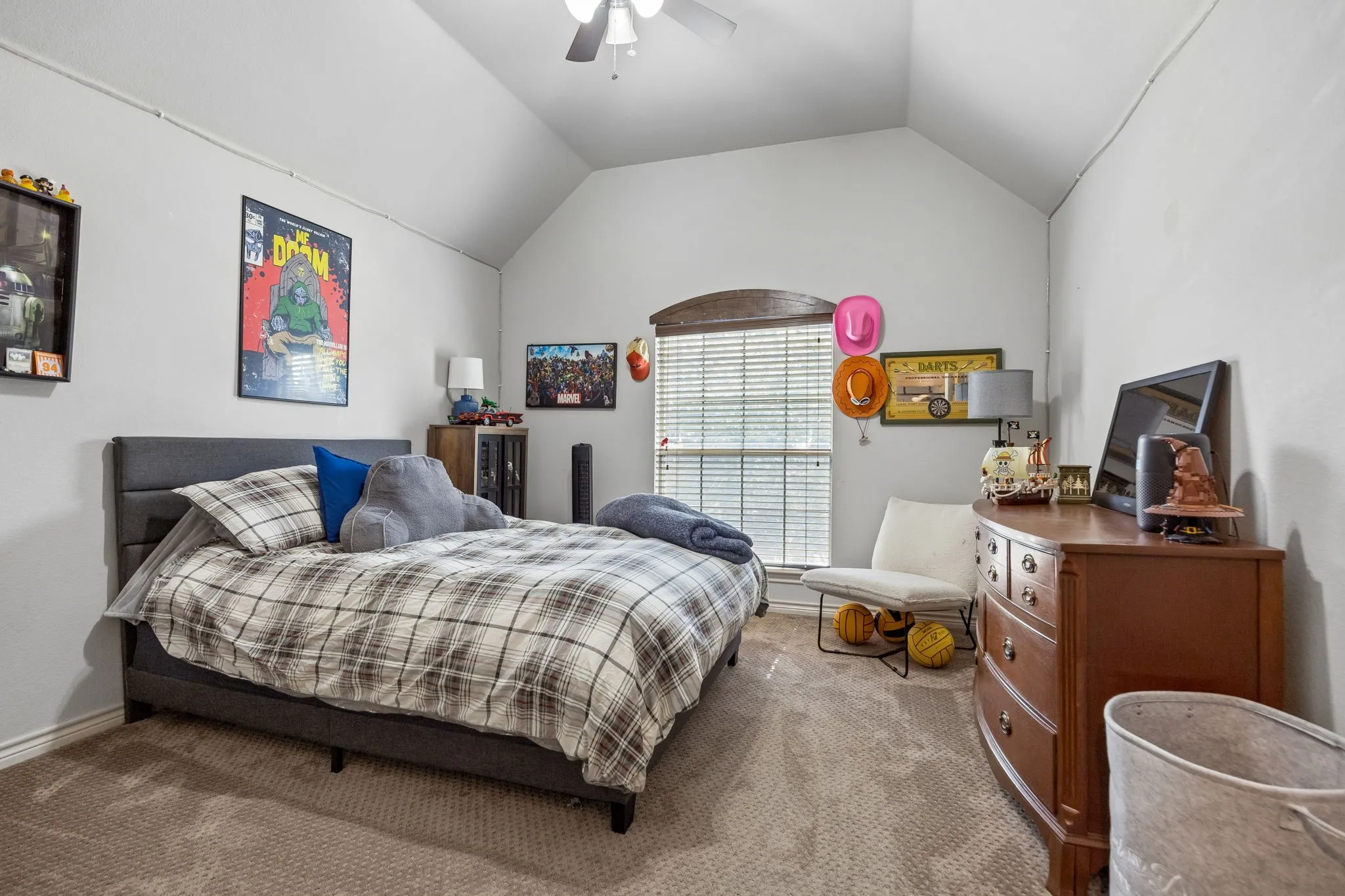 Comfortable Bedrooms Throughout - Vaulted ceilings give this secondary bedroom an open, airy feel, while ample wall space and a well-proportioned layout make furniture placement easy.