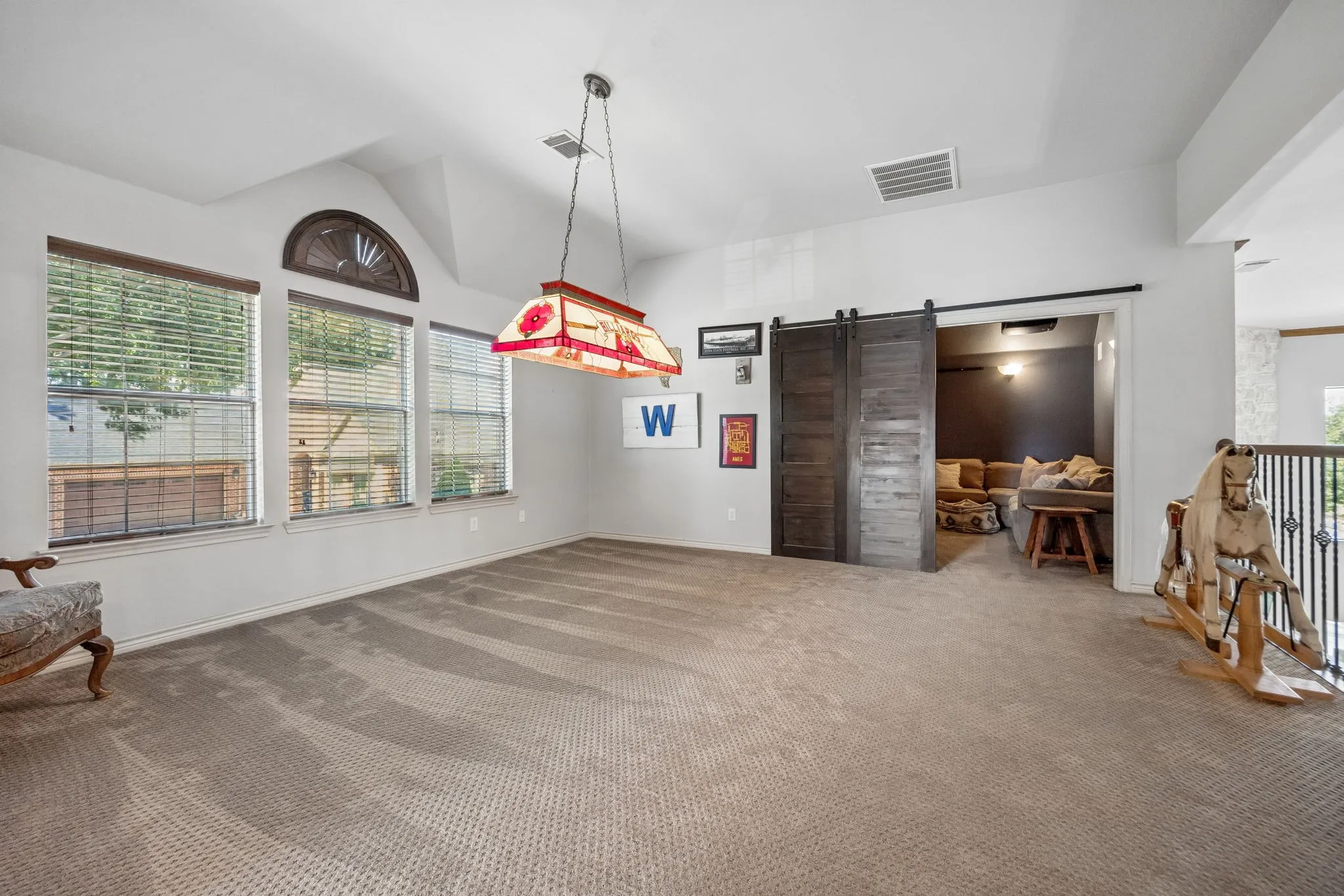An Upstairs Living Space with Options - The oversized game room provides plenty of room for recreation, lounging, hobbies or a second living area, with natural light and easy access to the surrounding bedrooms.