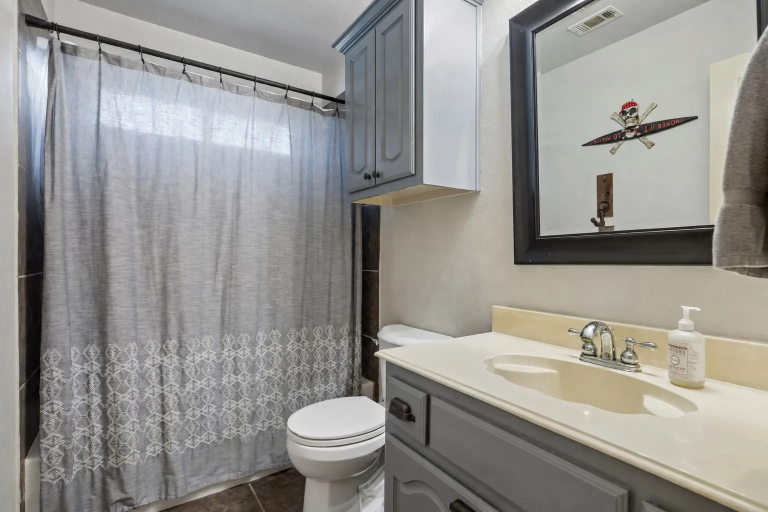 Convenient Upstairs Bath - A full tub and shower, vanity storage and additional wall cabinetry provide the functionality needed for busy mornings while serving the surrounding upstairs bedrooms.