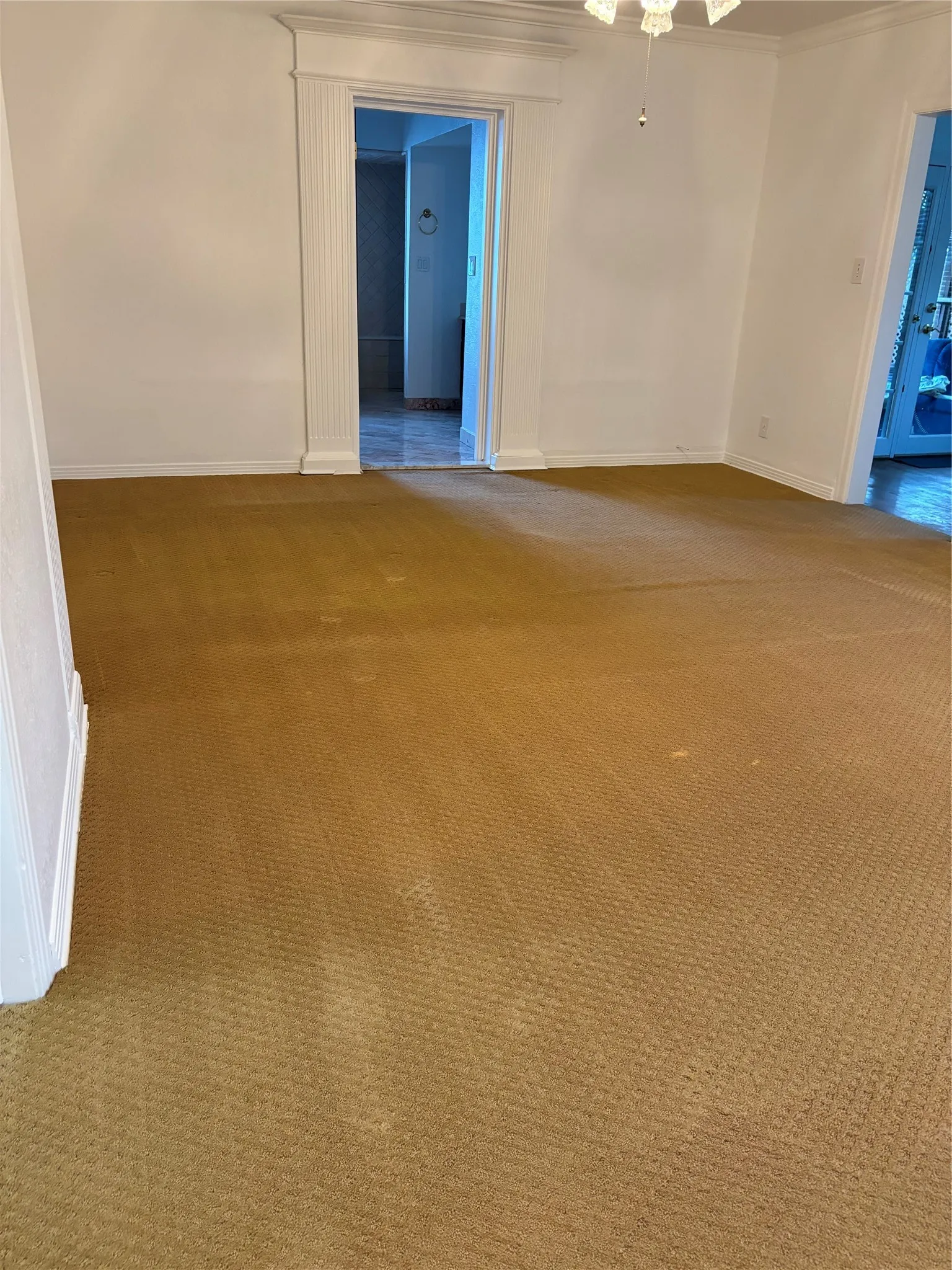 Carpeted spare room with baseboards