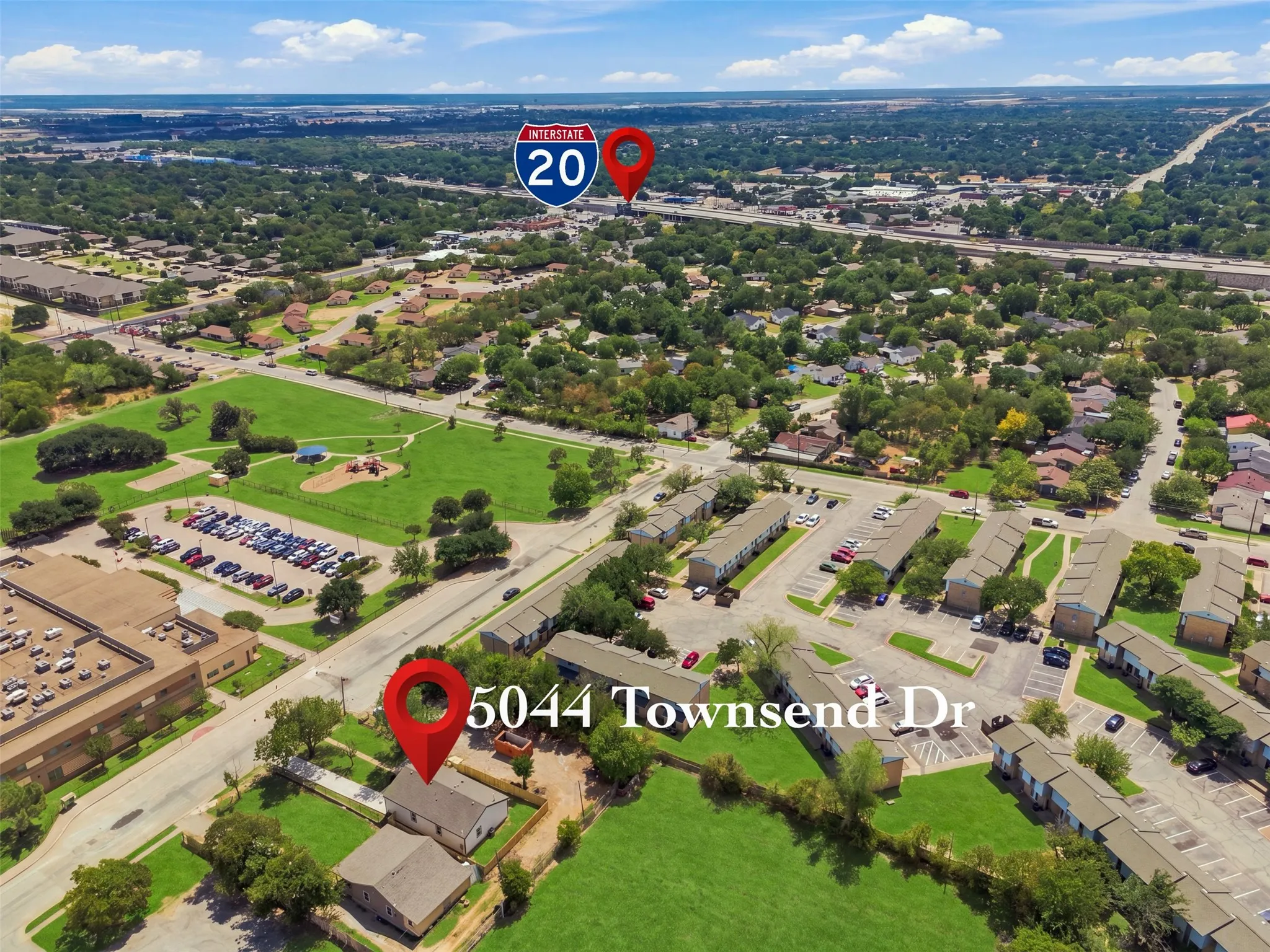 Aerial perspective showcasing the residential area with green spaces