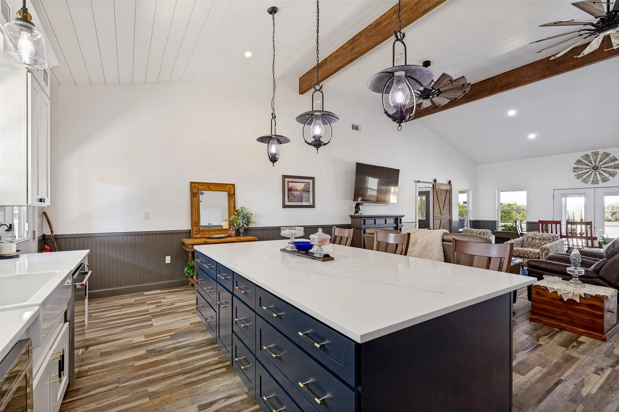 Open floor plan, beautiful beams and shiplap on ceiling.
