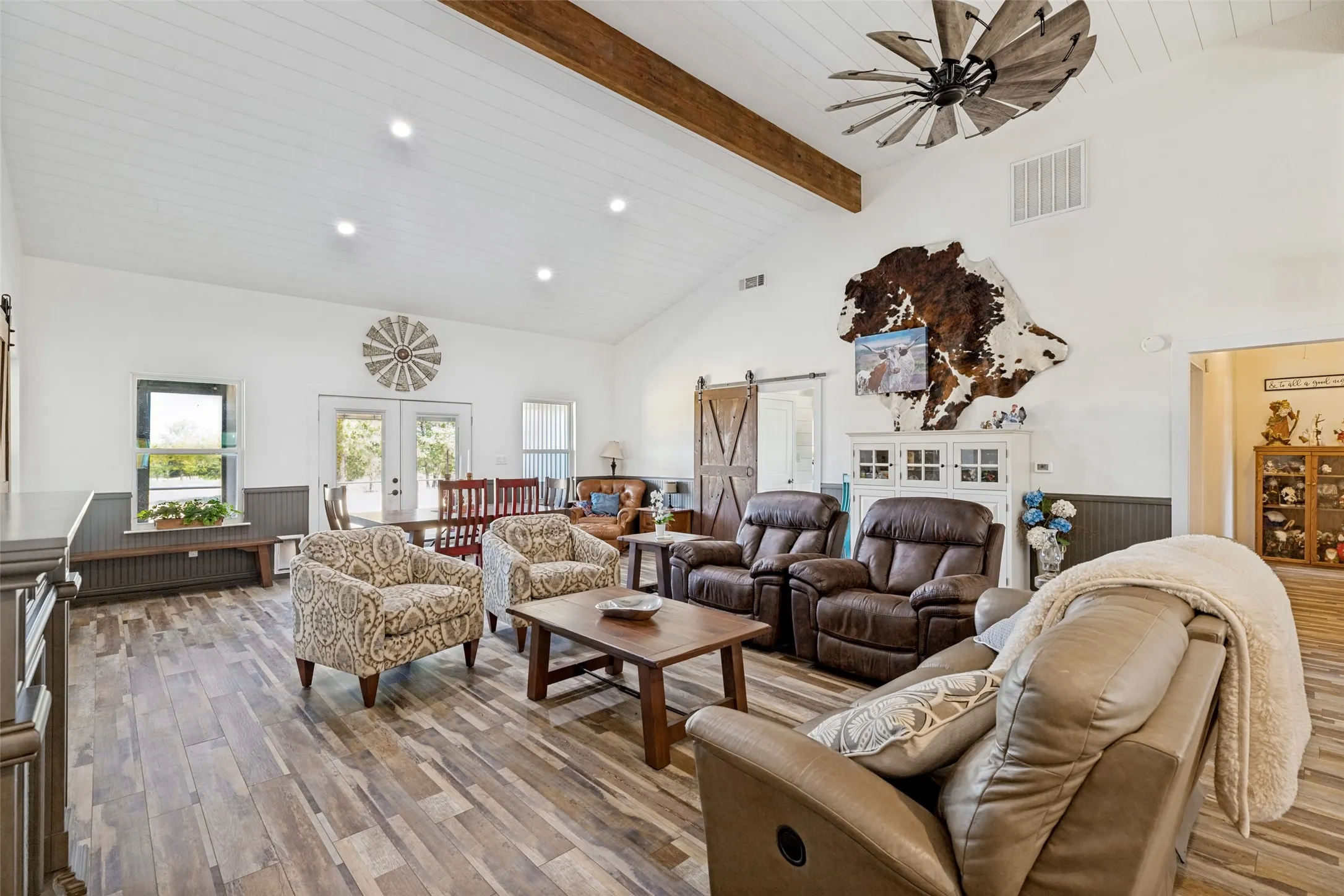 Living room with vaulted ceiling.