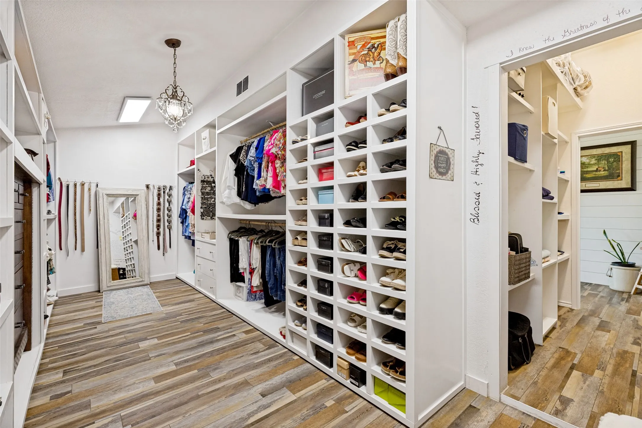 Amazing custom primary closet. Massive walk-in.