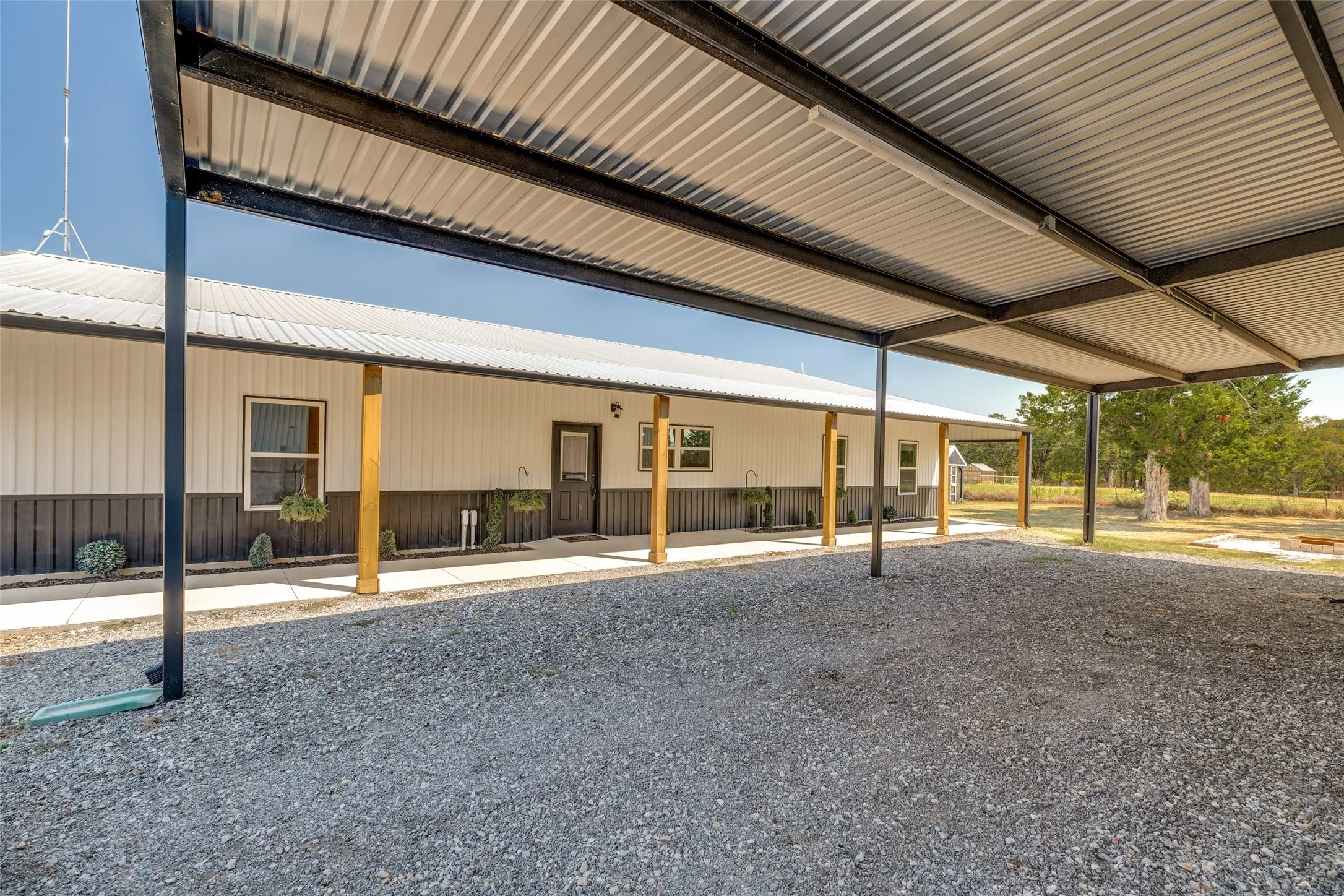 Large carport area attached to the shop. Tons of parking available.