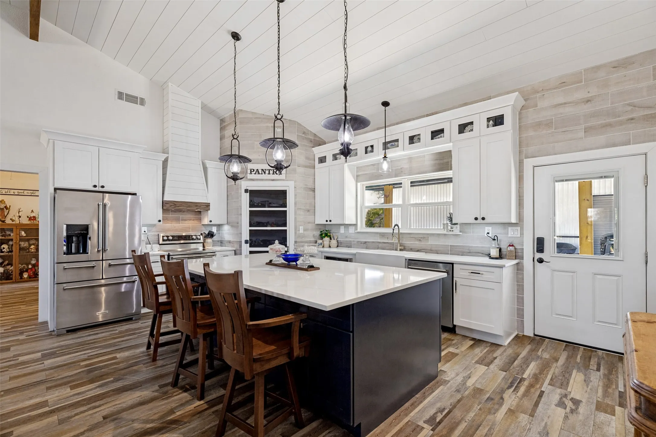 Beautiful kitchen with large island and lots of storage. Cabinetry is soft close.