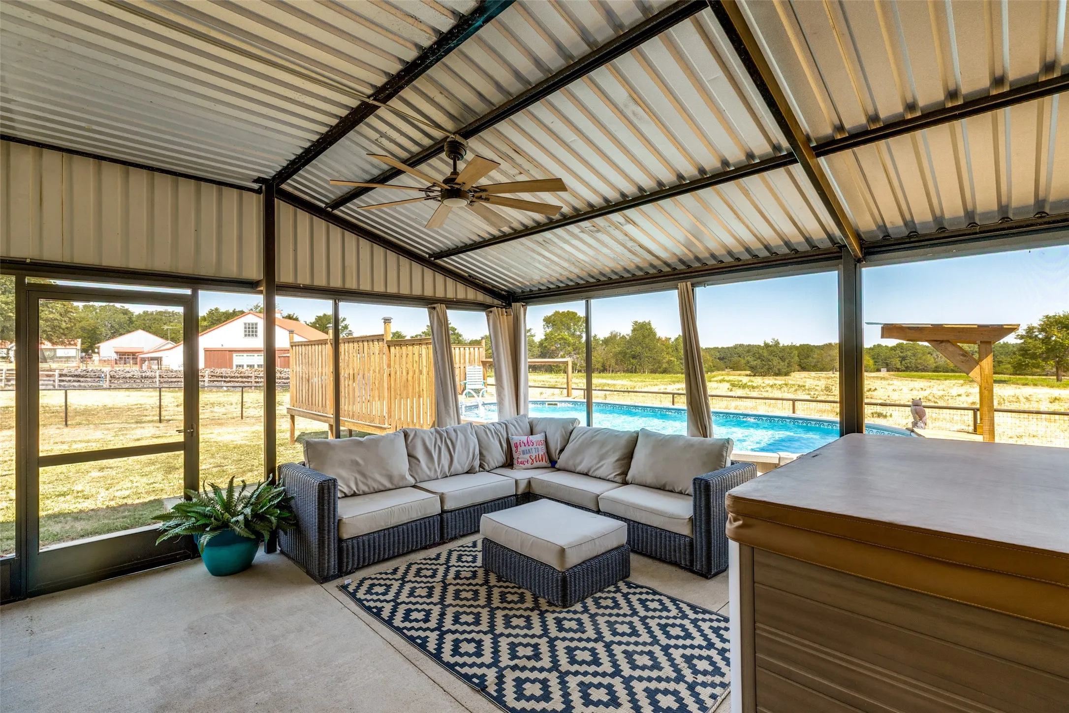 Screened in porch with views of the pool and all that land.
