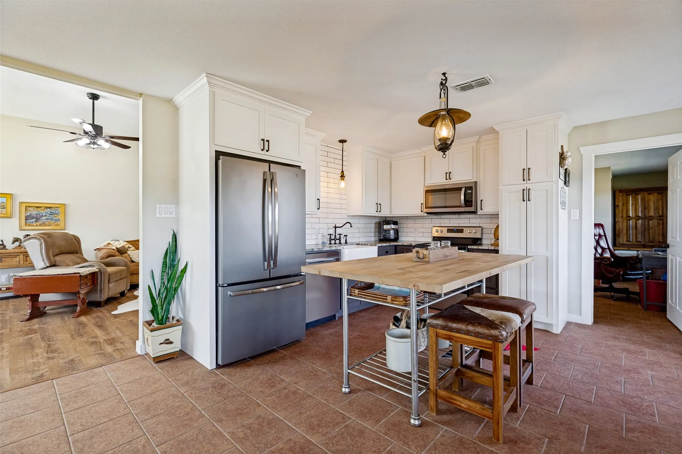 Kitchen with farm house sink and views into bedroom #1