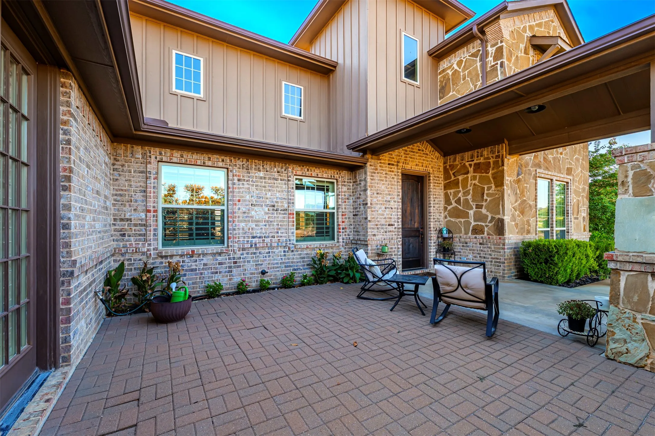 Brick and stone exterior with board and batten siding