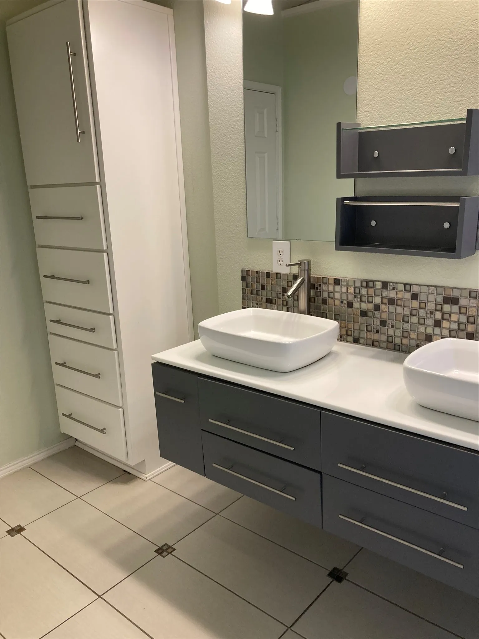 Primary bathroom has been updated with double sinks and a walk-in shower.