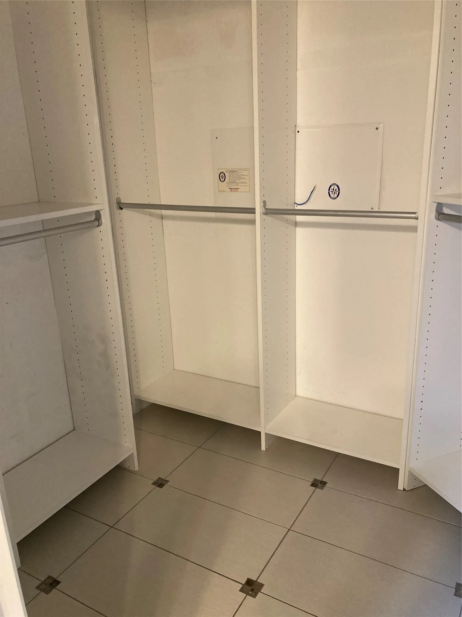 The large custom closet is located in the primary bathroom.