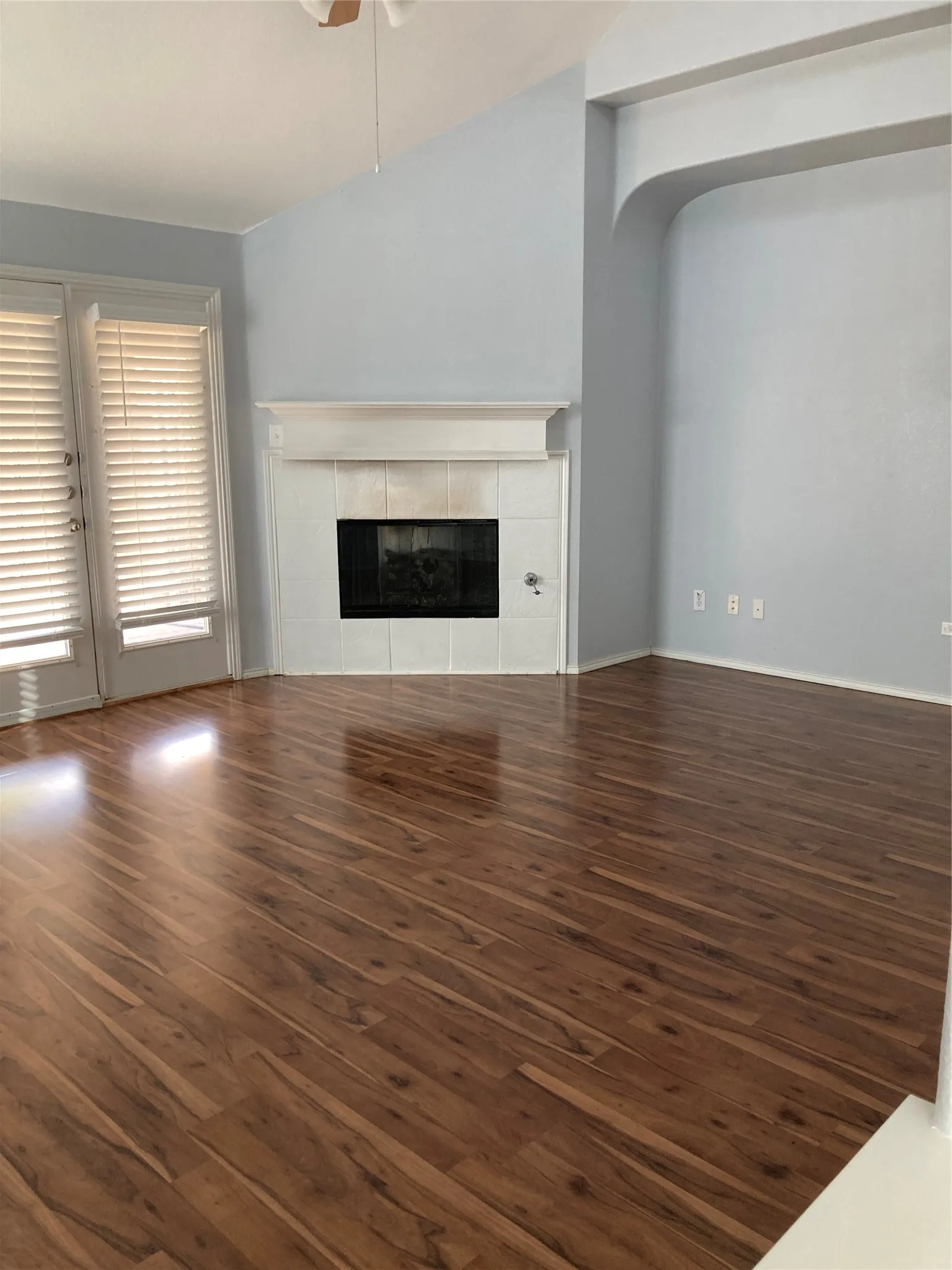 Corner fireplace in the family room leaves ample space for television on the adjoining wall.