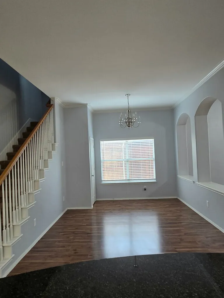 Formal dining room as viewed from the kitchen area.