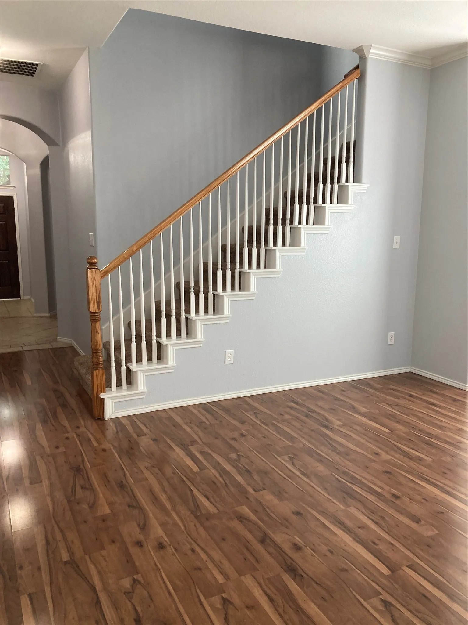 Formal dining room is located next to the stairway leading to the game/media room.
