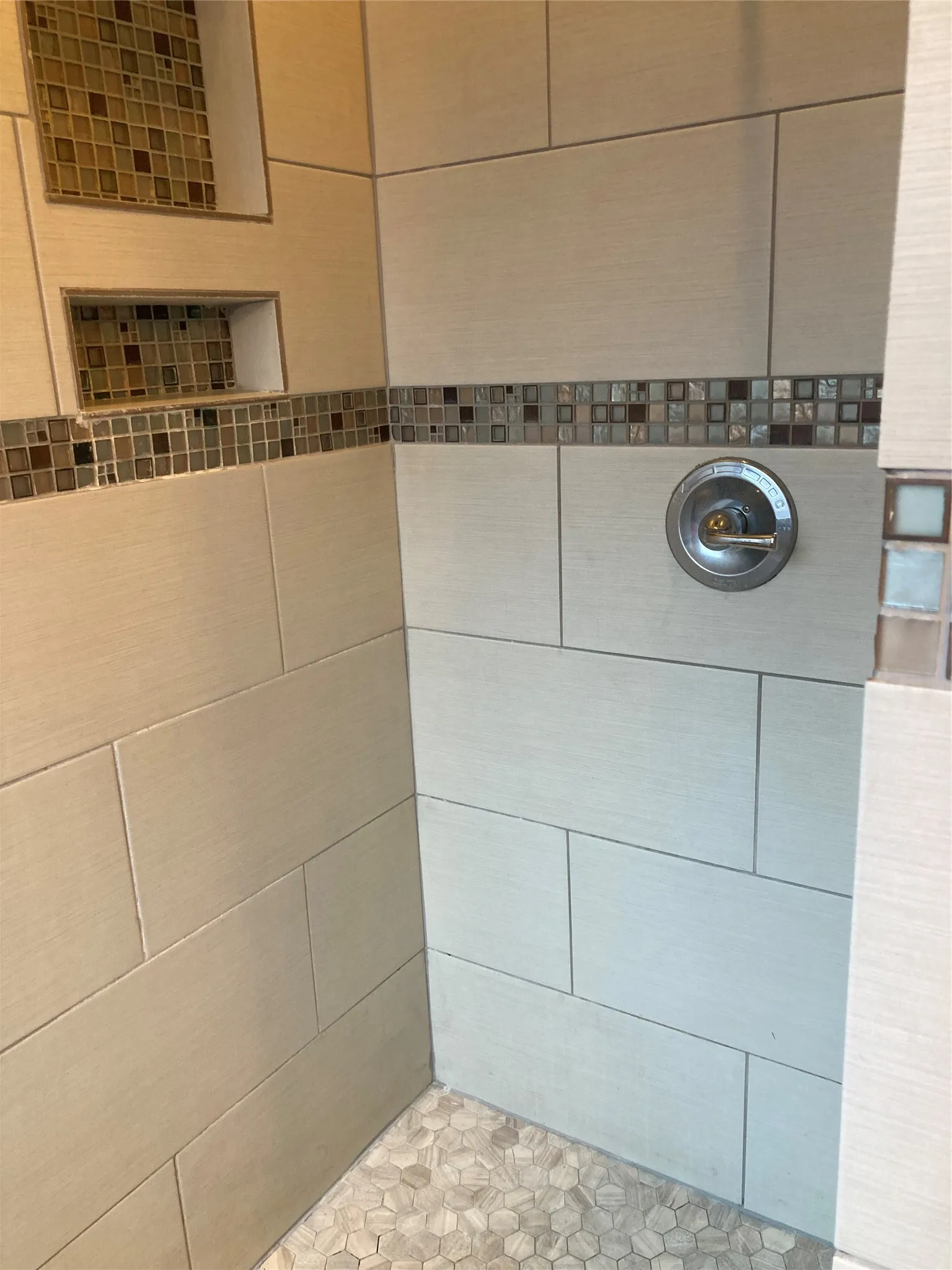 Updated shower in the primary bathroom.