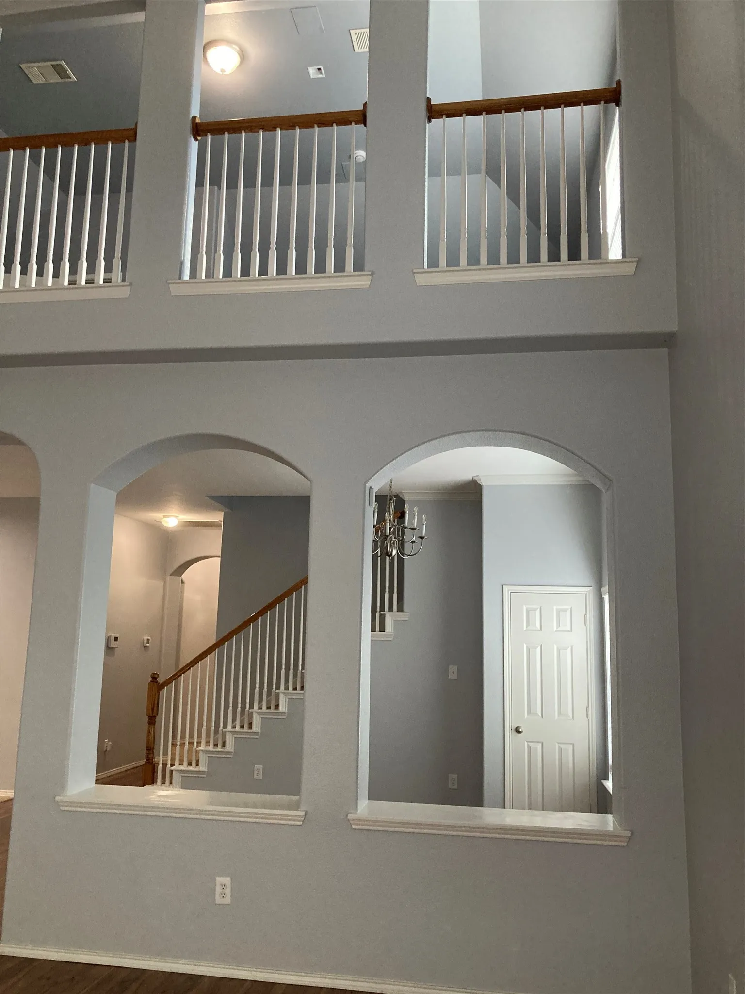 View of the dining room and the upstairs game/media room from the downstairs family room.
