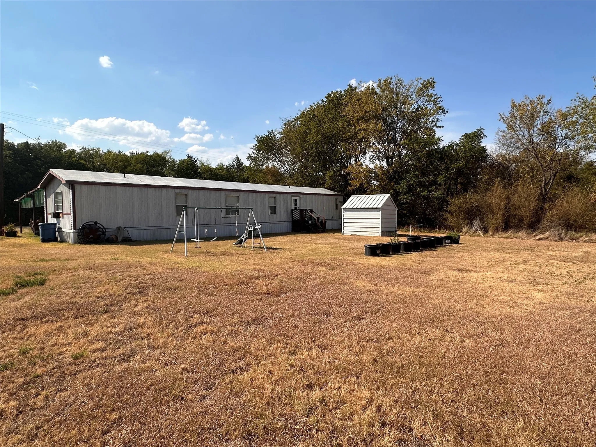 Back yard behind the Mobile Home