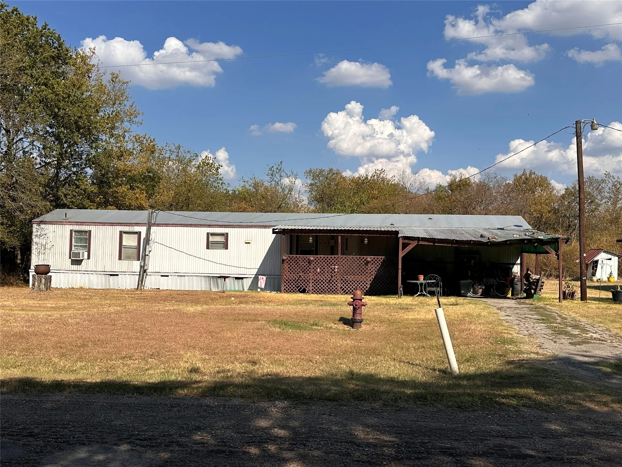 Singlewide mobile home with a covered carport