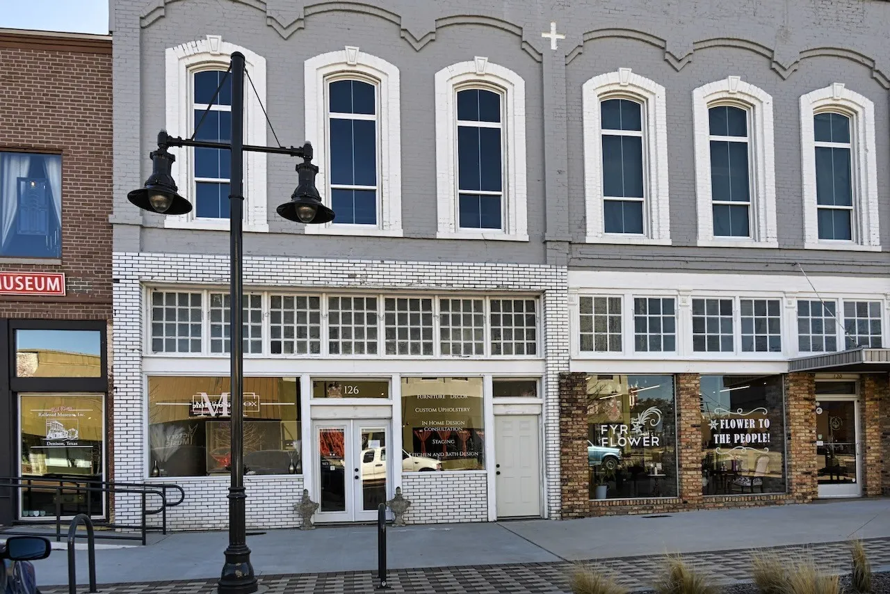 Historic brick facade with tall arched windows