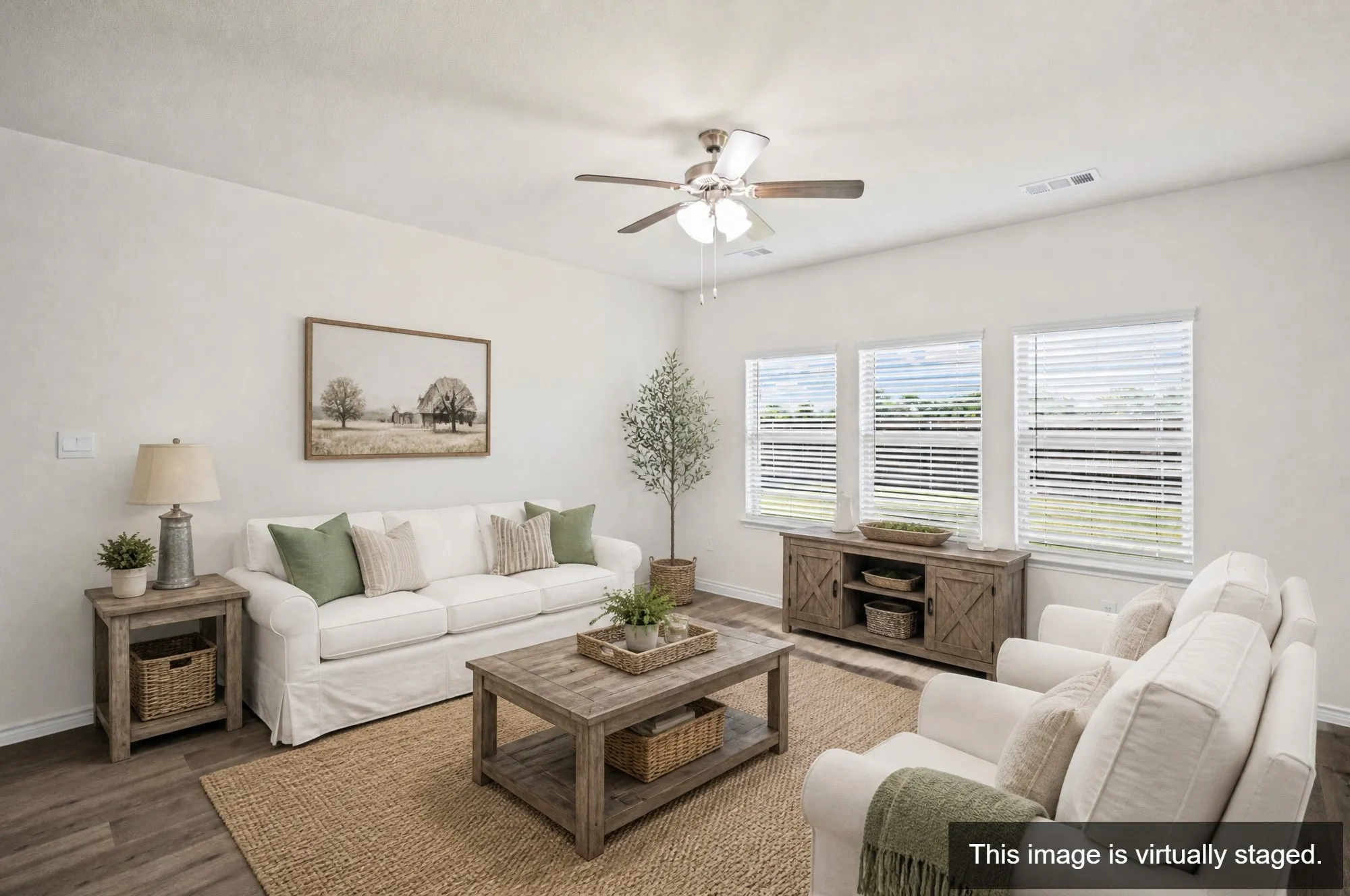 Bright living room with ceiling fan and recessed lighting, complemented by large windows with plantation shutters providing natural light and privacy