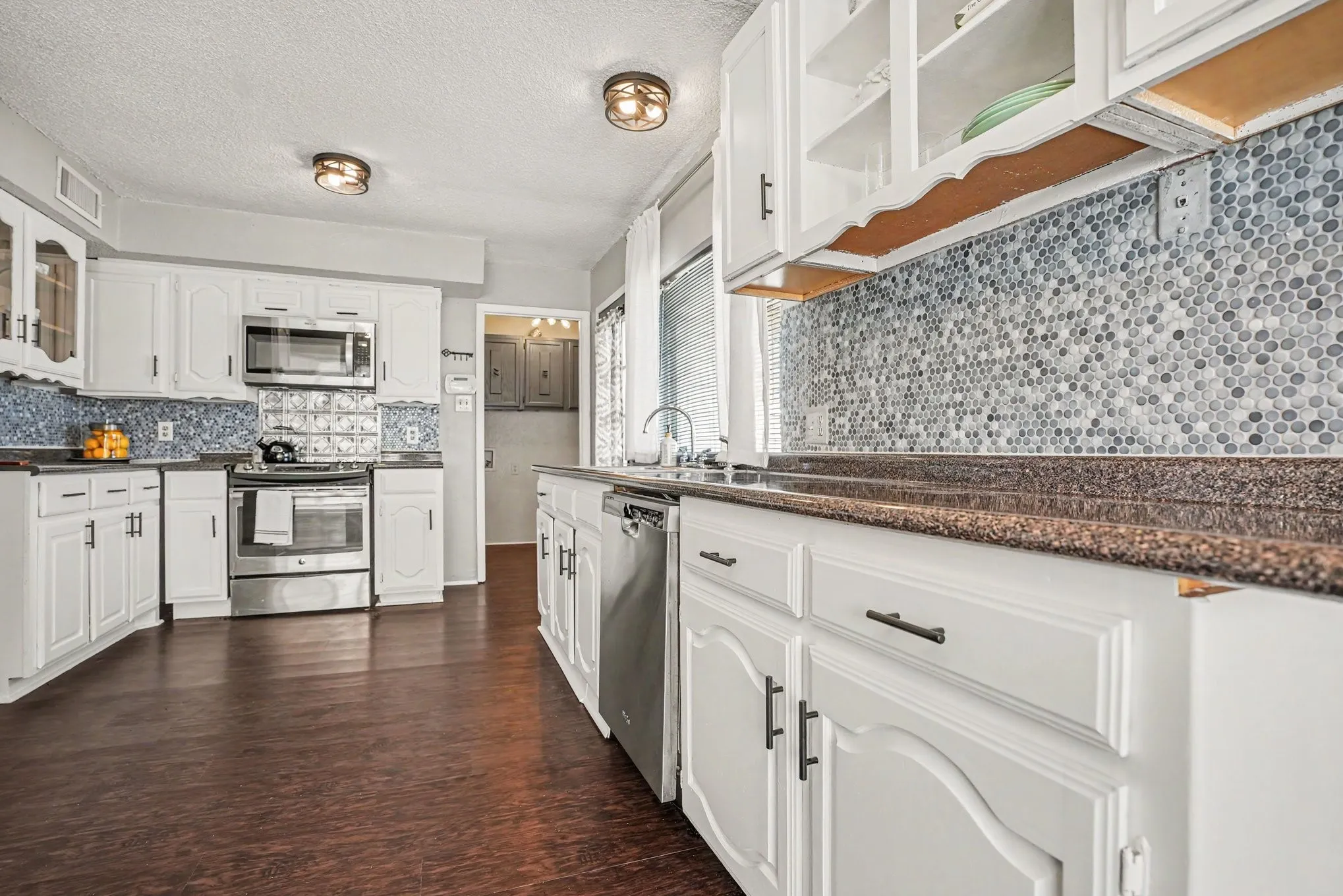 Open kitchen with stainless steel appliances