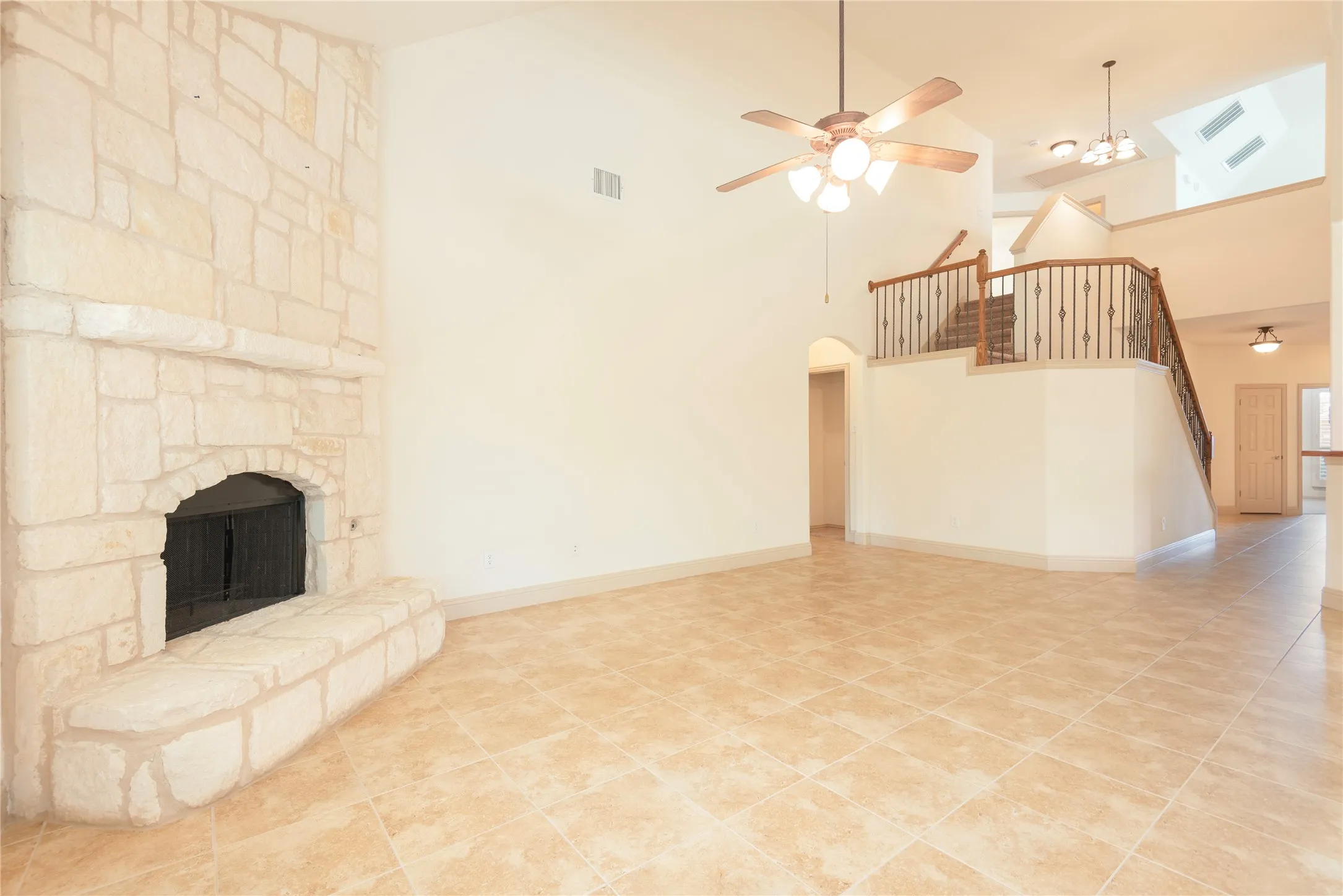 Stone fireplace with mantel and hearth