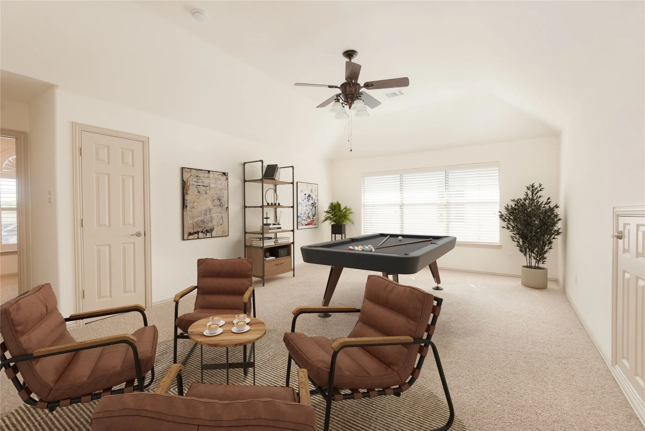 VIRTUALLY STAGED
Carpeted room with vaulted ceiling, ceiling fan, and window blinds