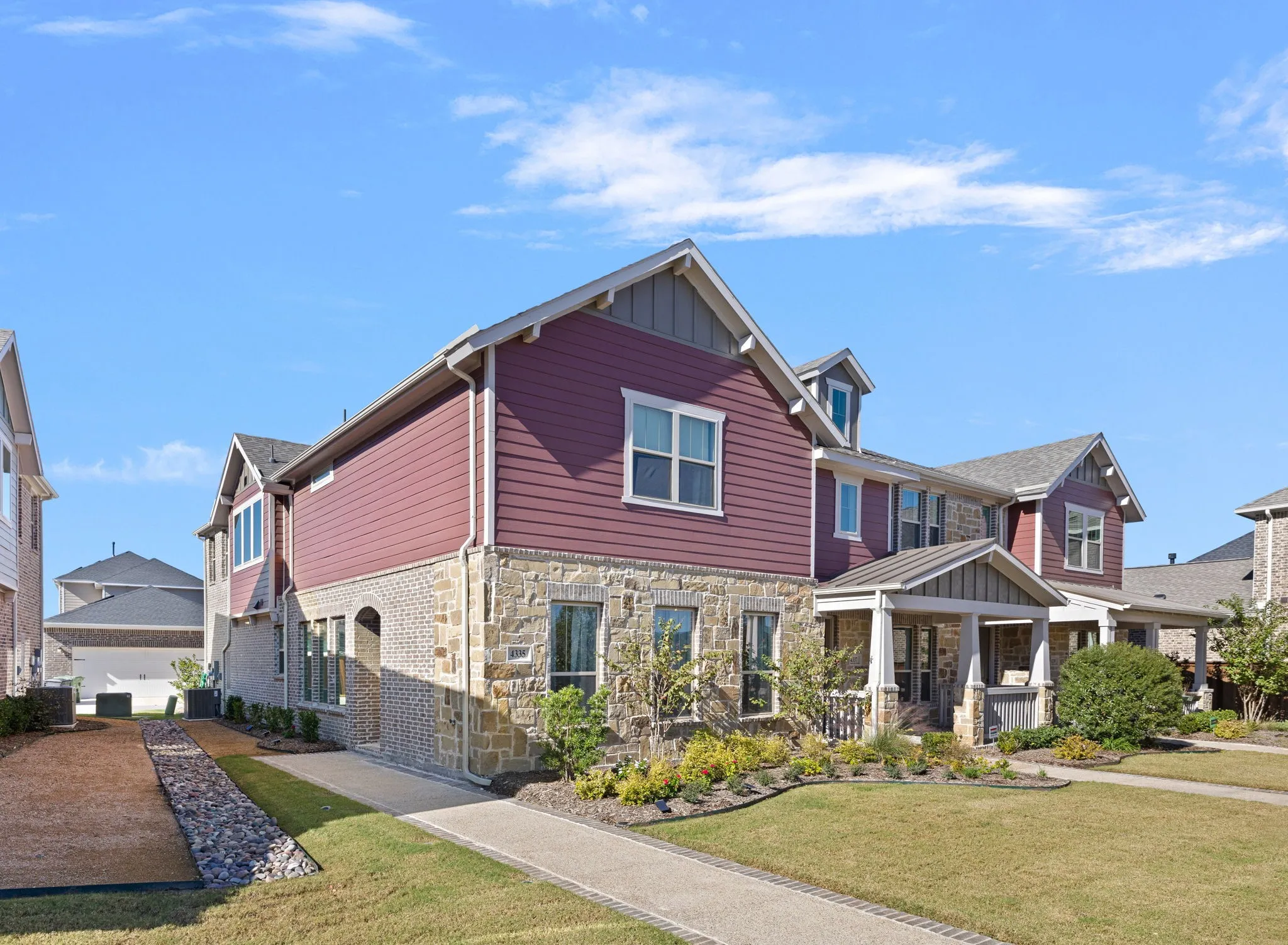 Stone and siding exterior with gabled roof lines