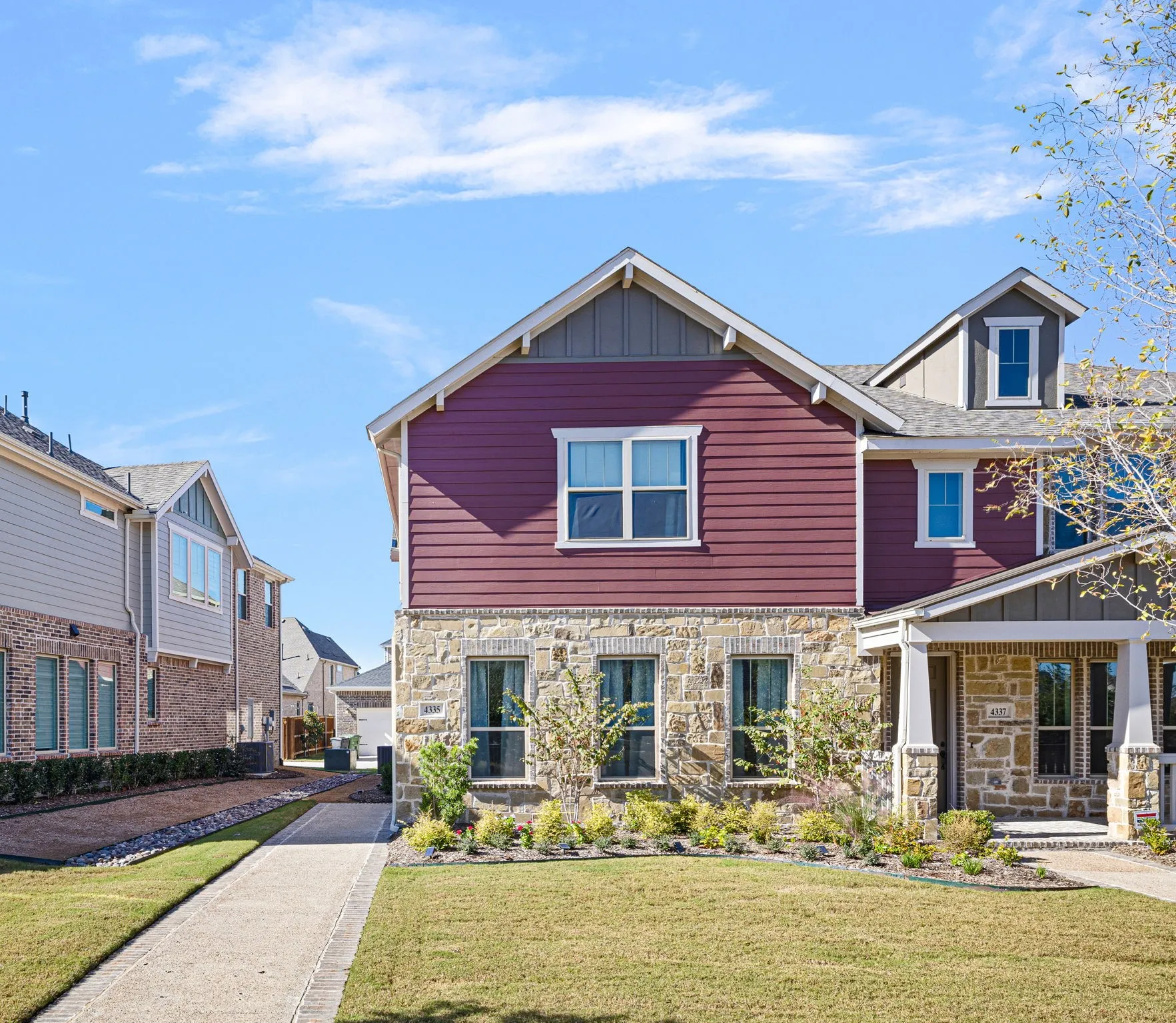 Stone and siding exterior with gabled roof lines