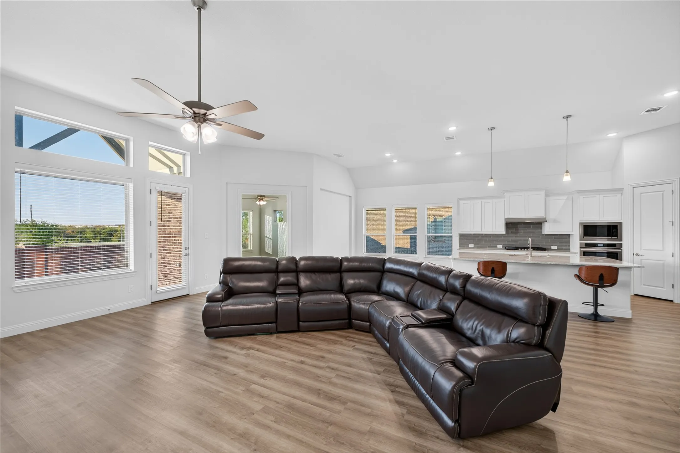 Vaulted ceilings and wood-finish flooring