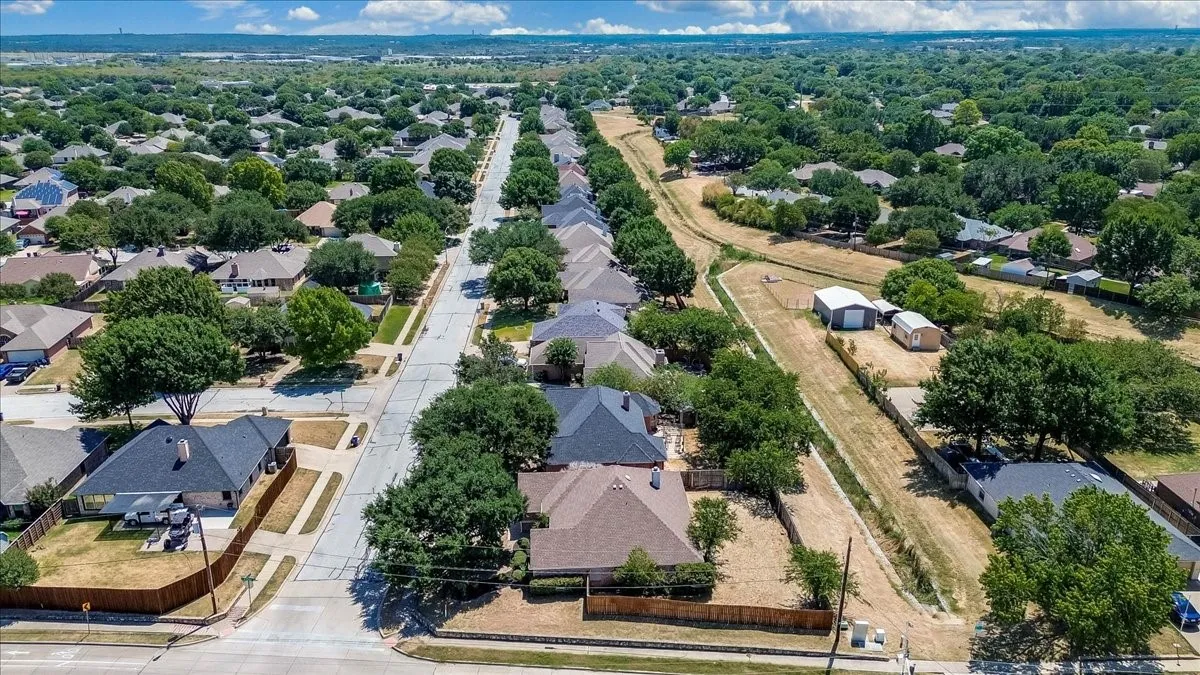 Residential street with mature tree-lined sidewalks
