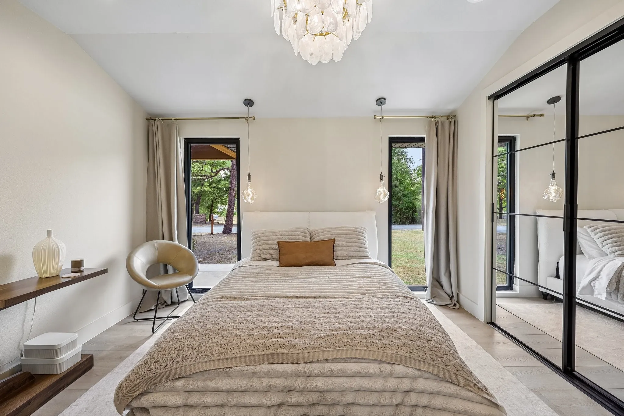 Sleek & modenr master bedroom with charging station in the closet.