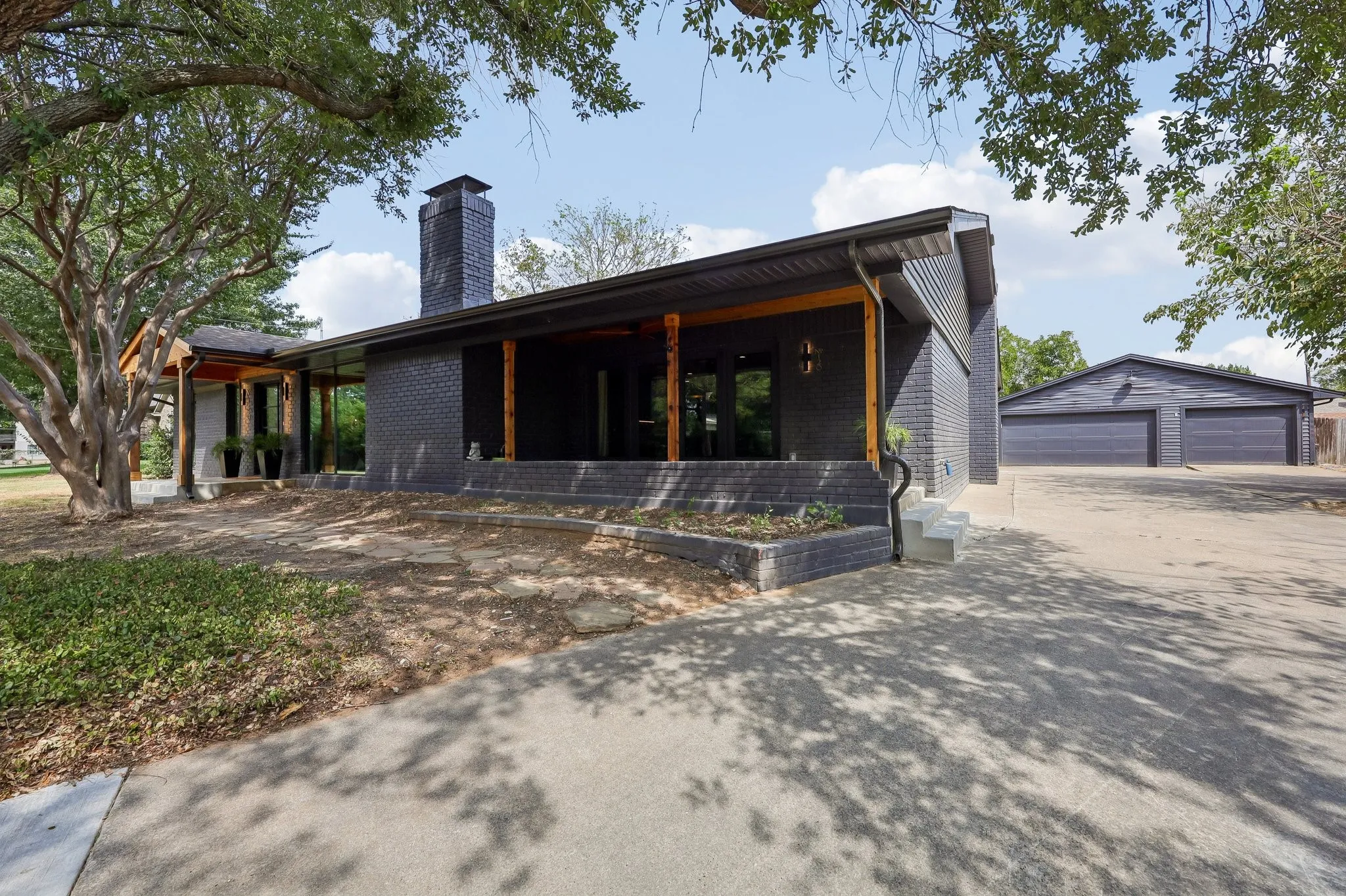 Oversized 3 car garage & long driveway can accomodate lots of cars. RV/Boat parking to the right.
