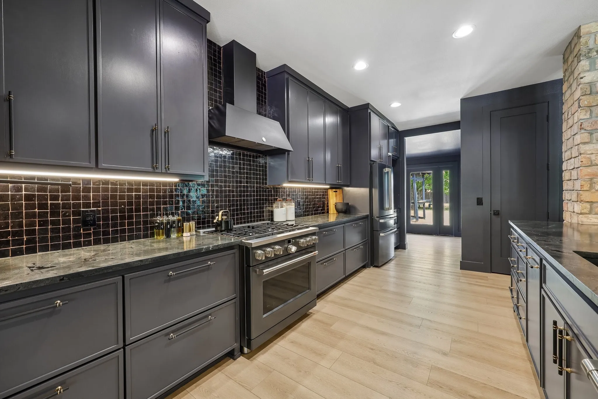 This is the kitchen you've dreamt of! Gorgeous hardware,  Professional grade GE Cafe oven, beverage station & outlets in the pantry.